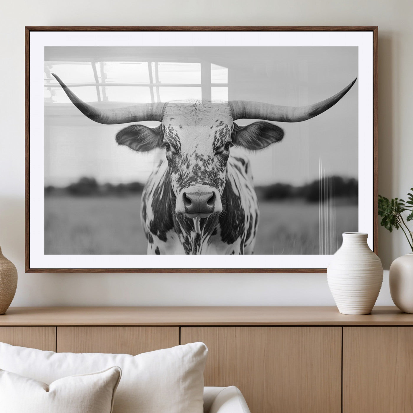 Capture the strength and elegance of nature with this striking black and white portrait of a longhorn cow. Its powerful presence makes a bold statement in any room.