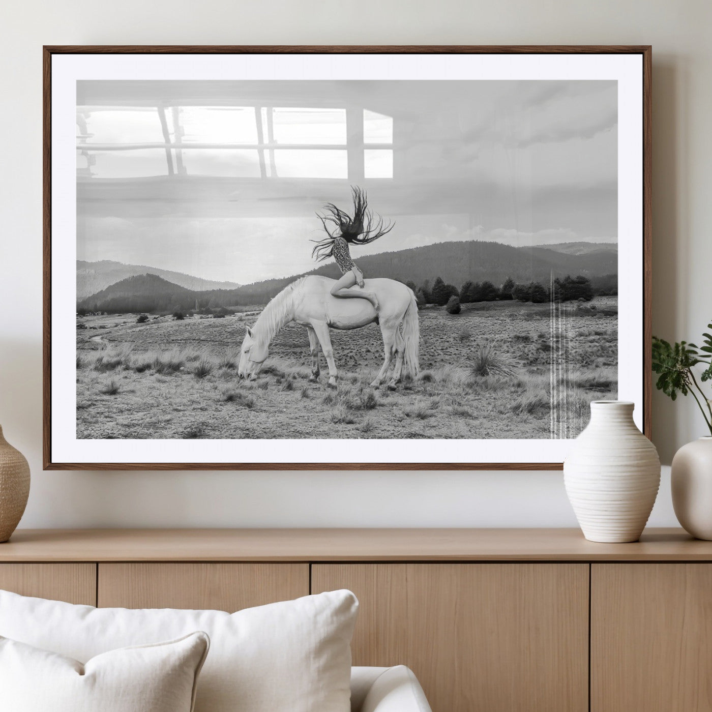 Black and white photo of a woman on a white horse in moody tones, ideal for Western Boho or modern rustic-style home decor.