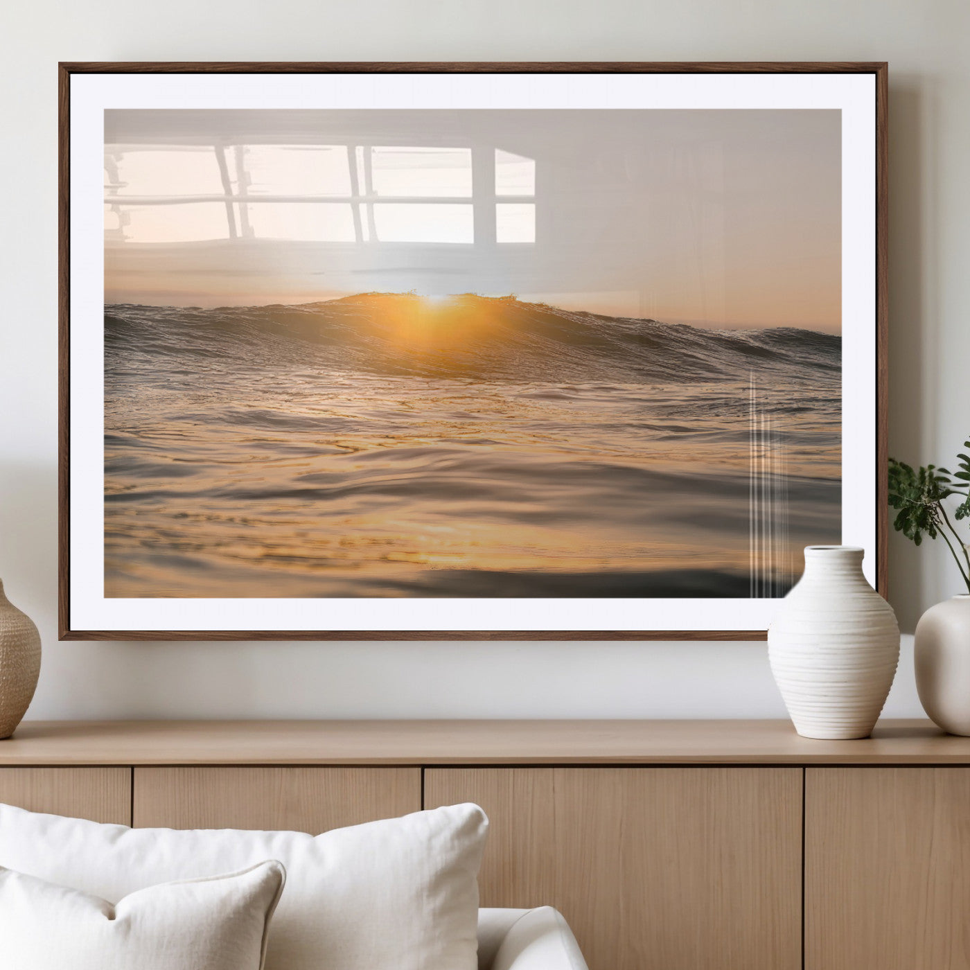 Ocean waves glowing under a warm golden sunset, reflecting soft light and calm movement, perfect for warm minimalist coastal interiors.