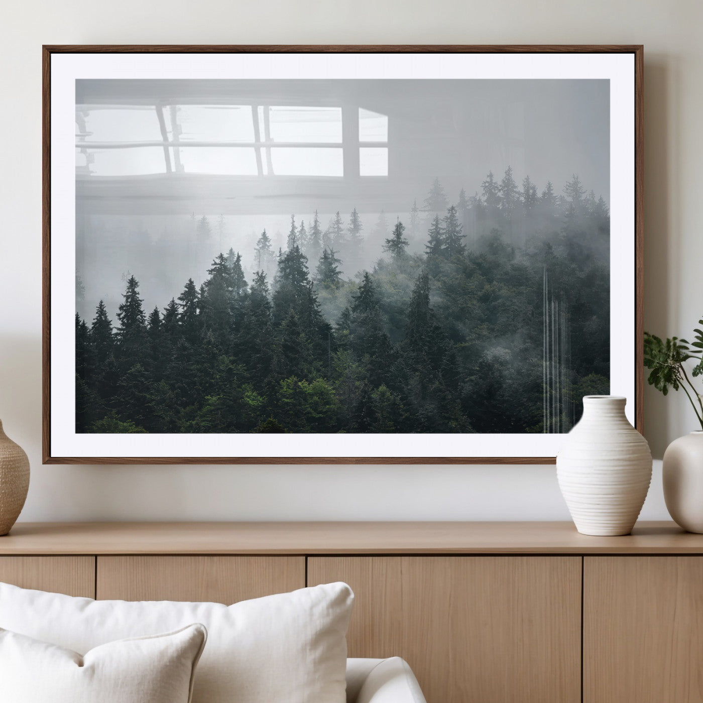 A misty evergreen forest shrouded in soft fog, creating a tranquil and moody landscape with lush green trees fading into the distance.