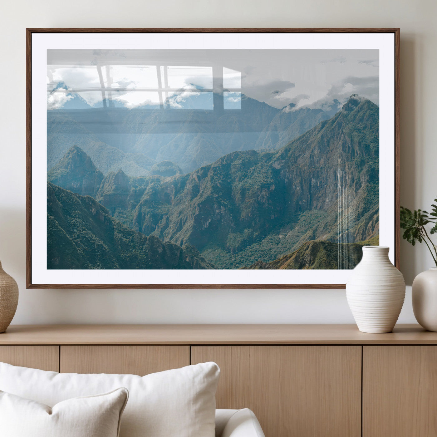 A misty mountain landscape with cloud-covered Andean peaks and lush green valleys, creating a dramatic and serene view, perfect for rustic or nature-inspired home decor.