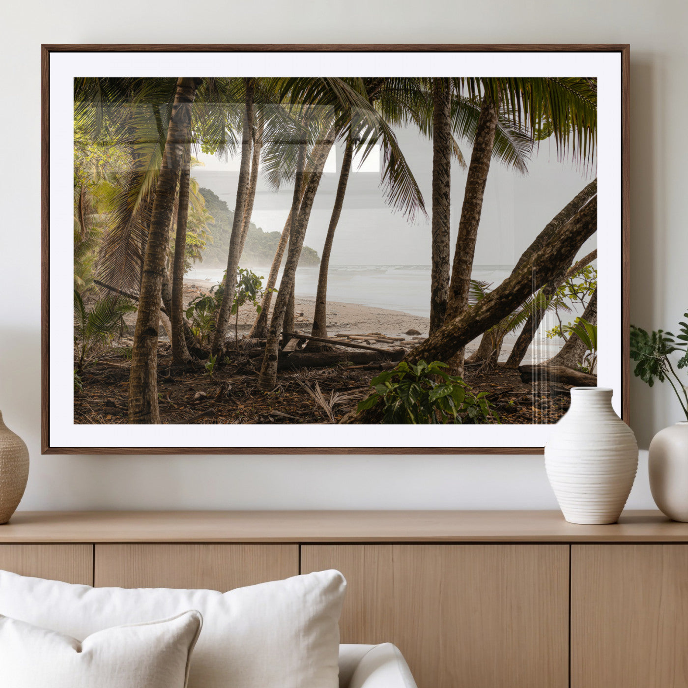 Dense tropical palm trees framing a sandy beach and ocean shore, ideal for jungle or coastal themed interior wall decor.
