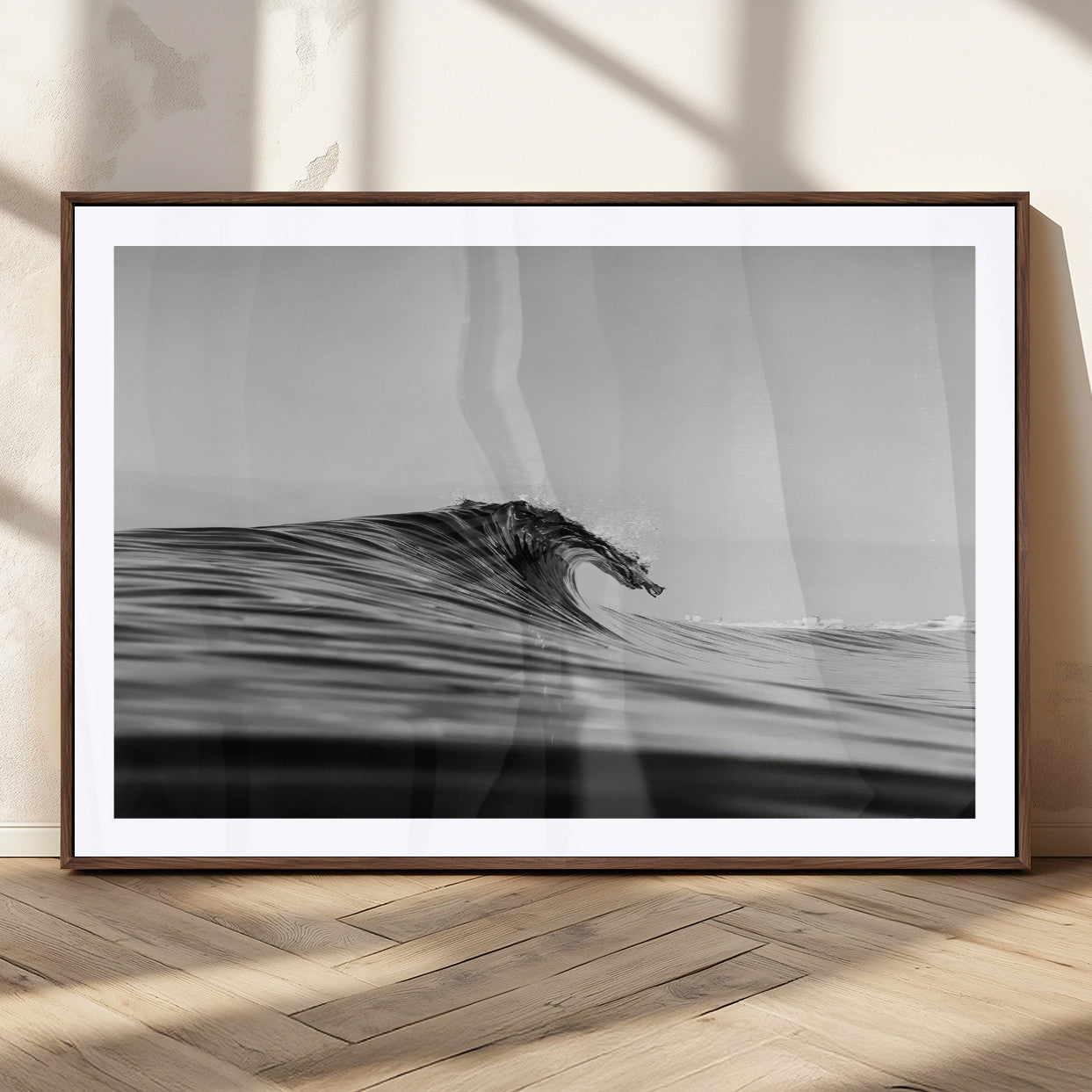 Striking black and white photo of a curling wave, ideal for modern coastal or minimalist wall decor settings.