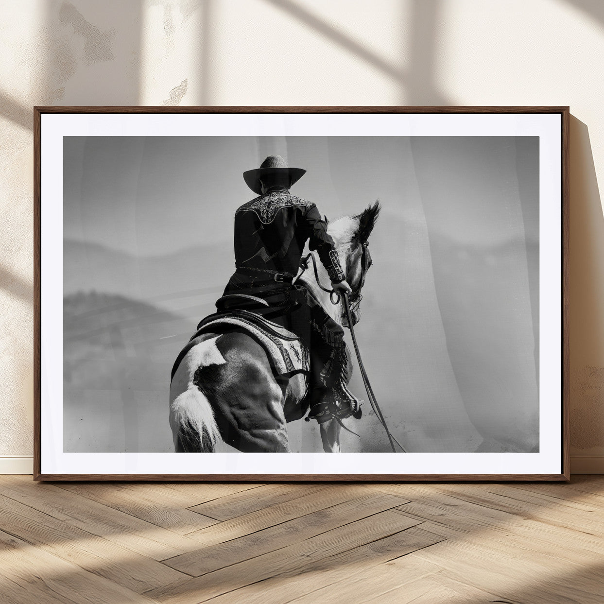 Black and white canvas of a cowboy on horseback with moody tones, perfect for rustic western or country-inspired home decor.