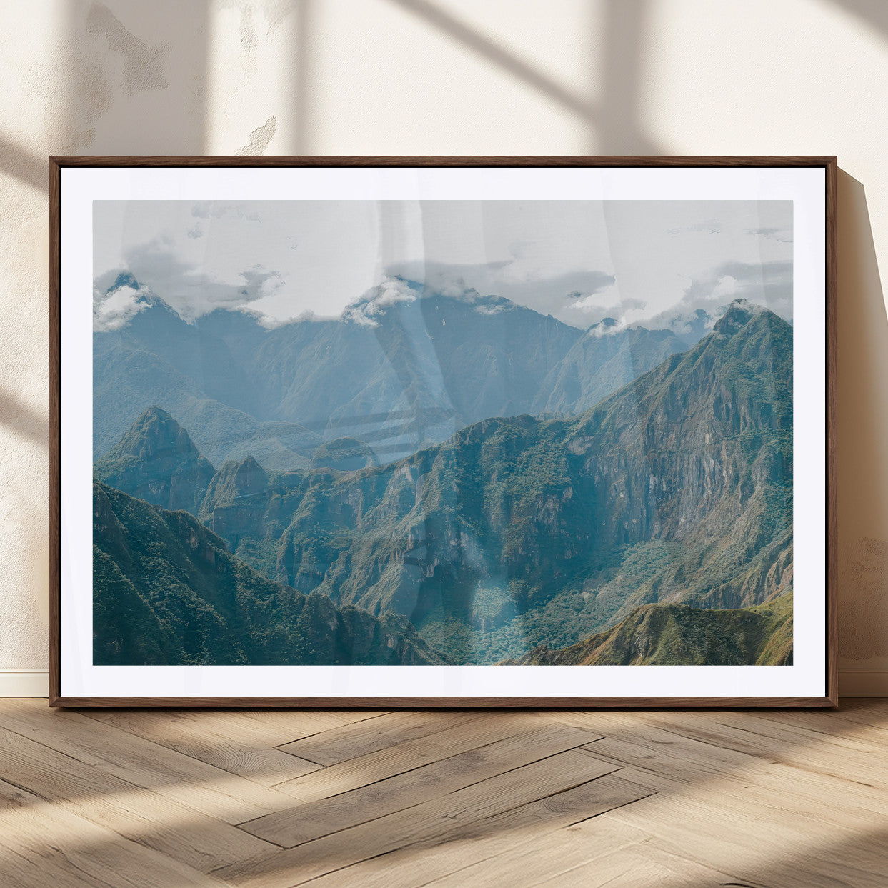 A misty mountain landscape with cloud-covered Andean peaks and lush green valleys, creating a dramatic and serene view, perfect for rustic or nature-inspired home decor.