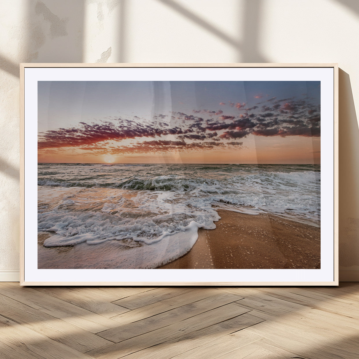 Canvas of a sunset over a foamy ocean shore with warm light and gentle waves, ideal for coastal or beach-themed home decor.
