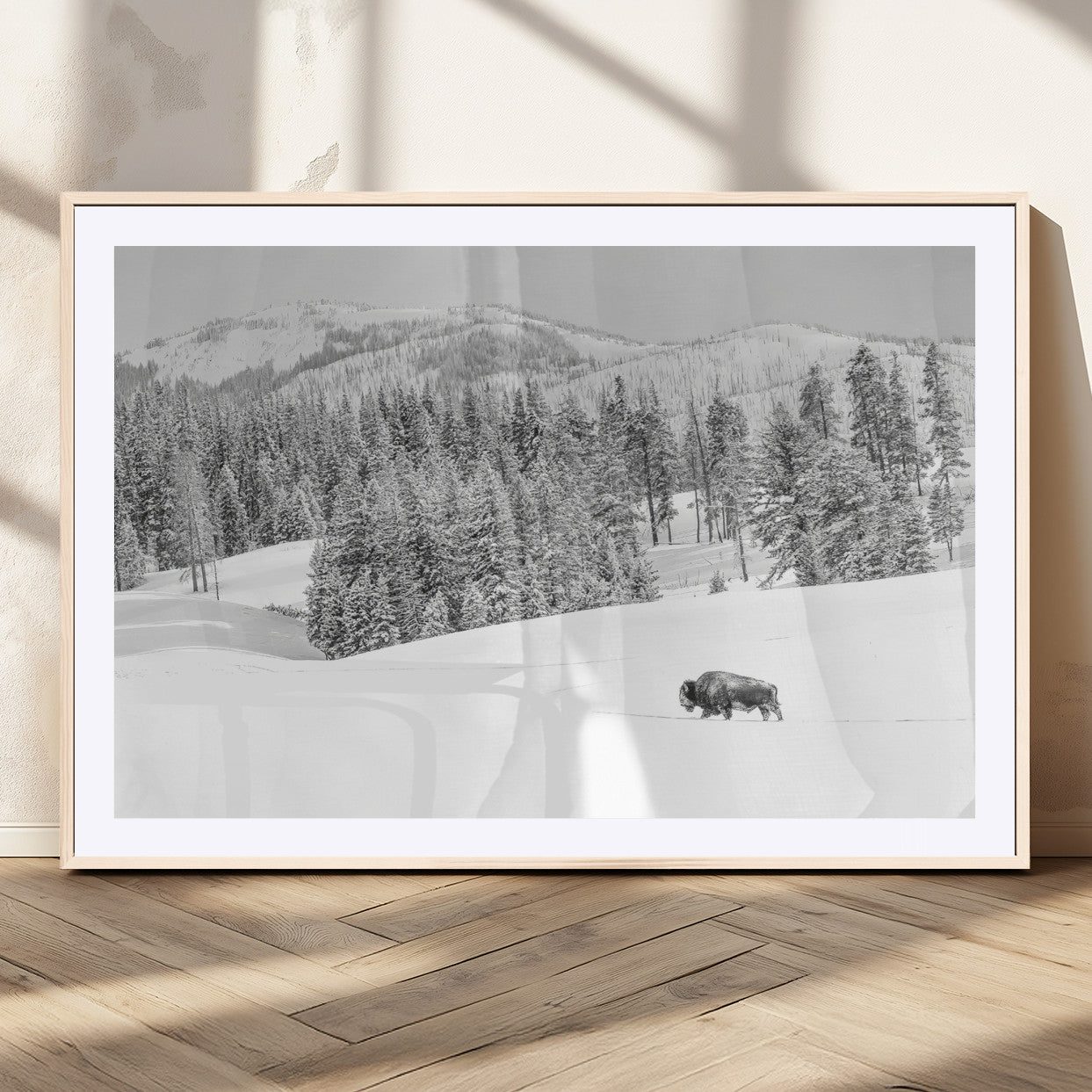Snowy bison walking through white forest landscape, ideal for monochrome winter or wilderness-style interior wall decoration.
