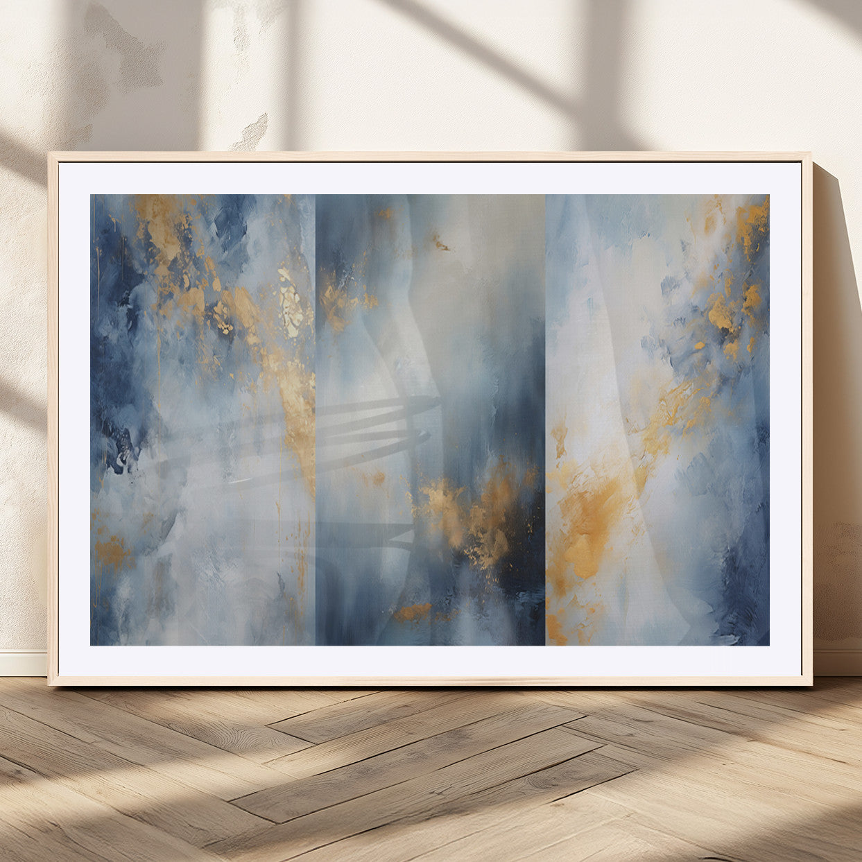 Abstract canvas art in soft blue and gold tones with textured brushstrokes, ideal for elegant or modern neutral decor spaces.