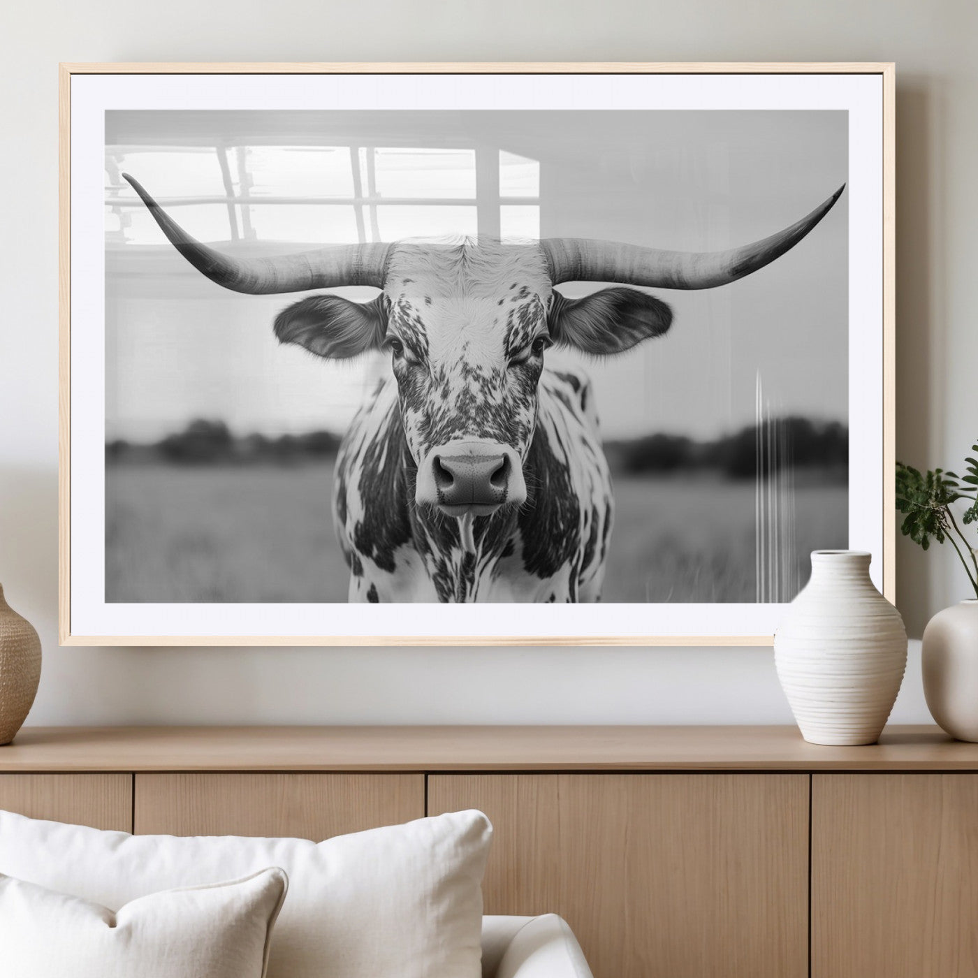 Capture the strength and elegance of nature with this striking black and white portrait of a longhorn cow. Its powerful presence makes a bold statement in any room.