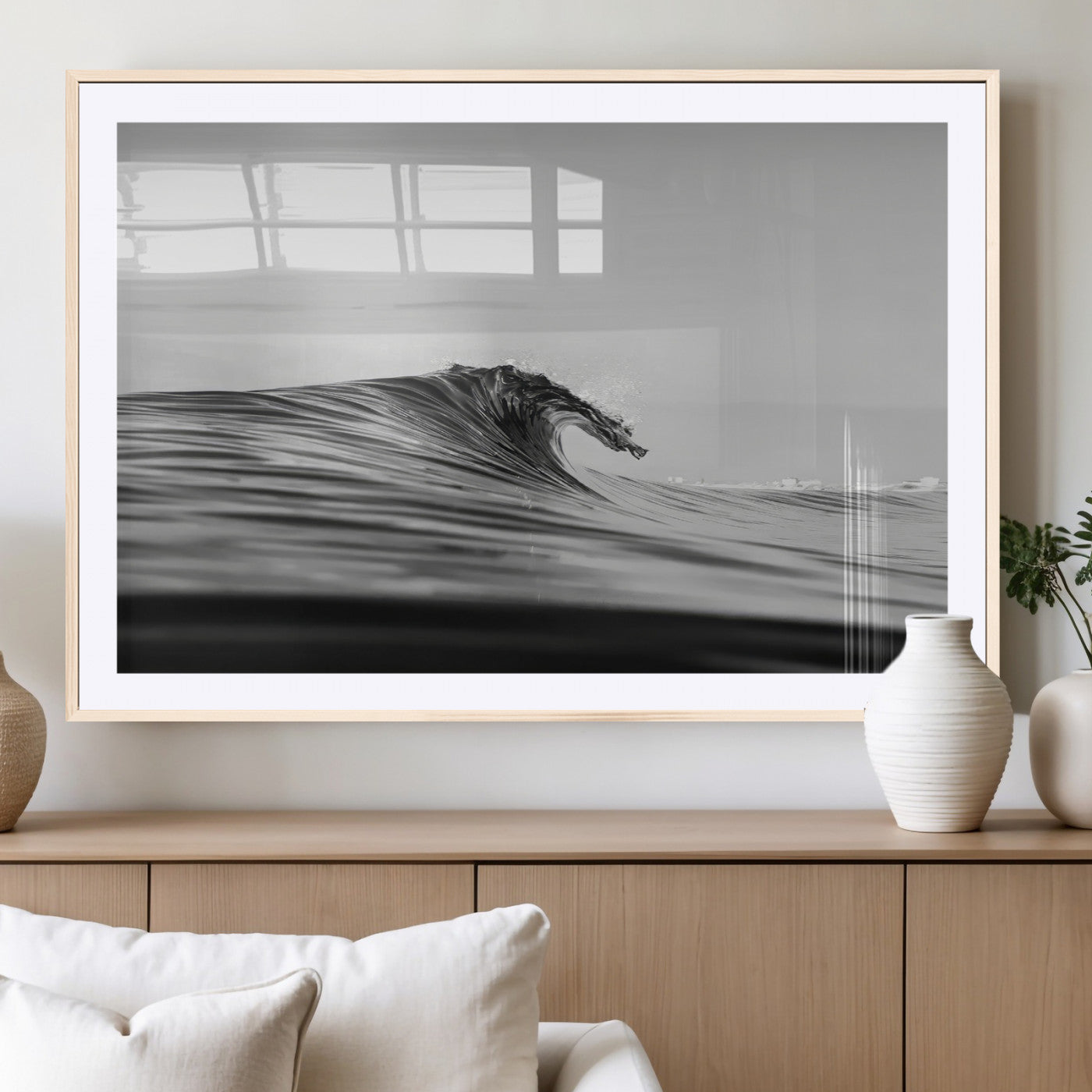 Striking black and white photo of a curling wave, ideal for modern coastal or minimalist wall decor settings.