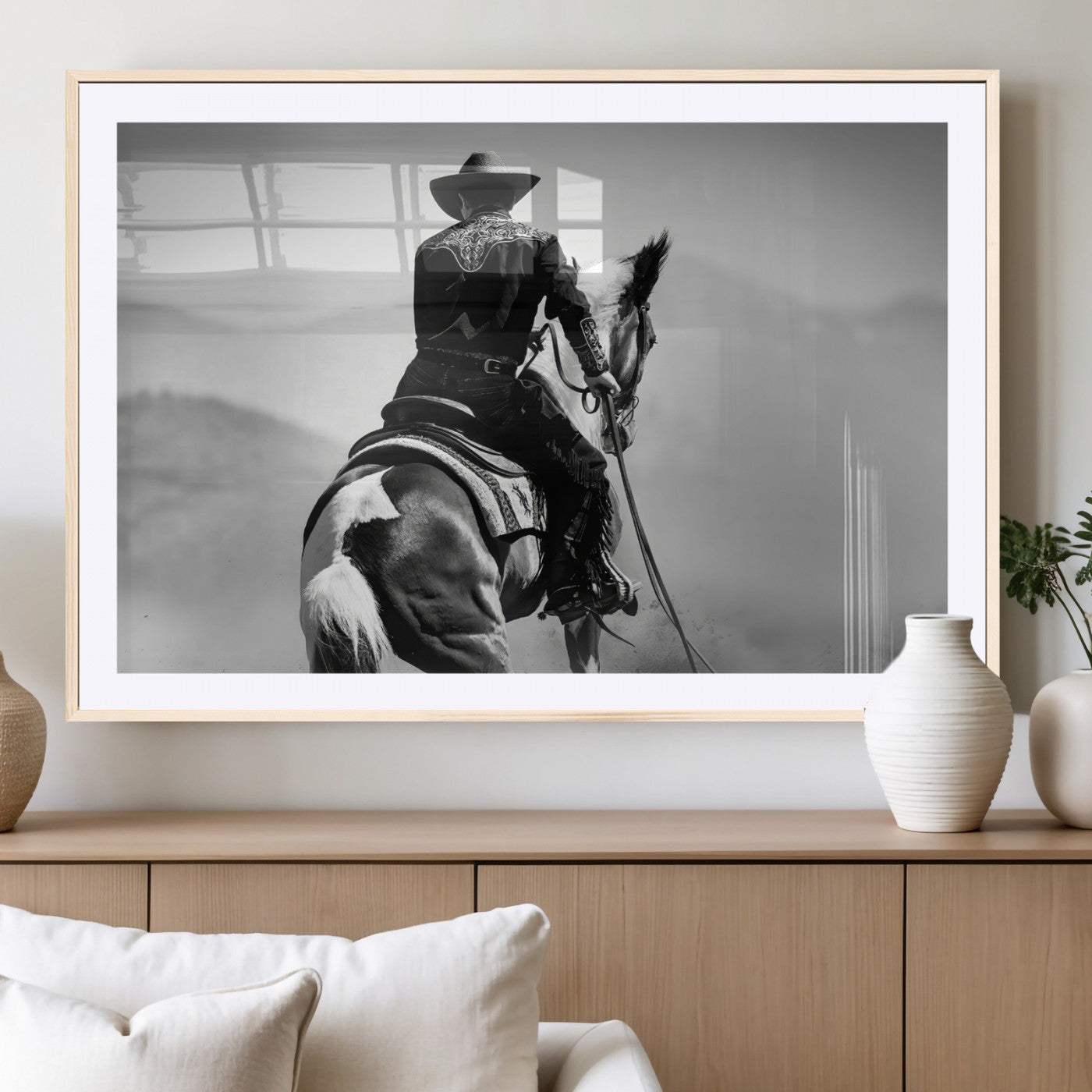 Black and white canvas of a cowboy on horseback with moody tones, perfect for rustic western or country-inspired home decor.