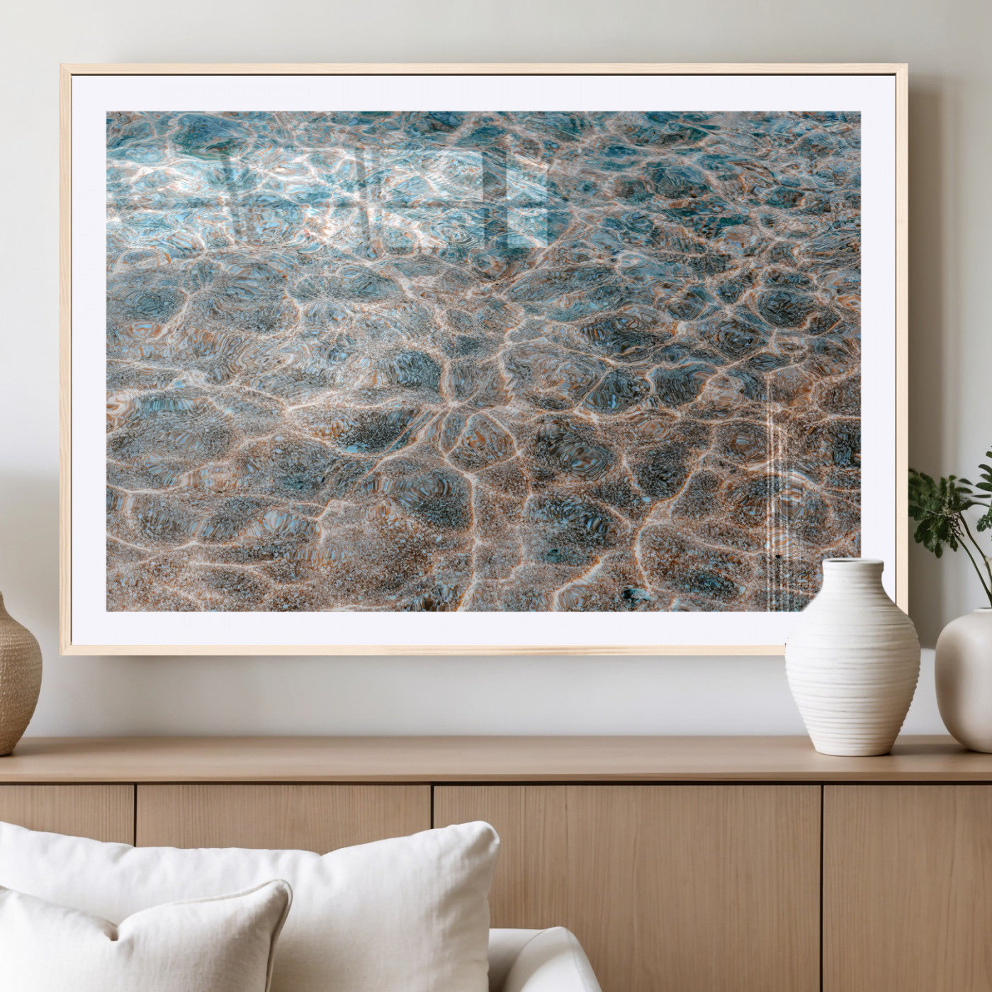 Close-up of sunlit ocean ripples with aqua blue and golden tones, ideal for modern coastal or minimalist home decor.