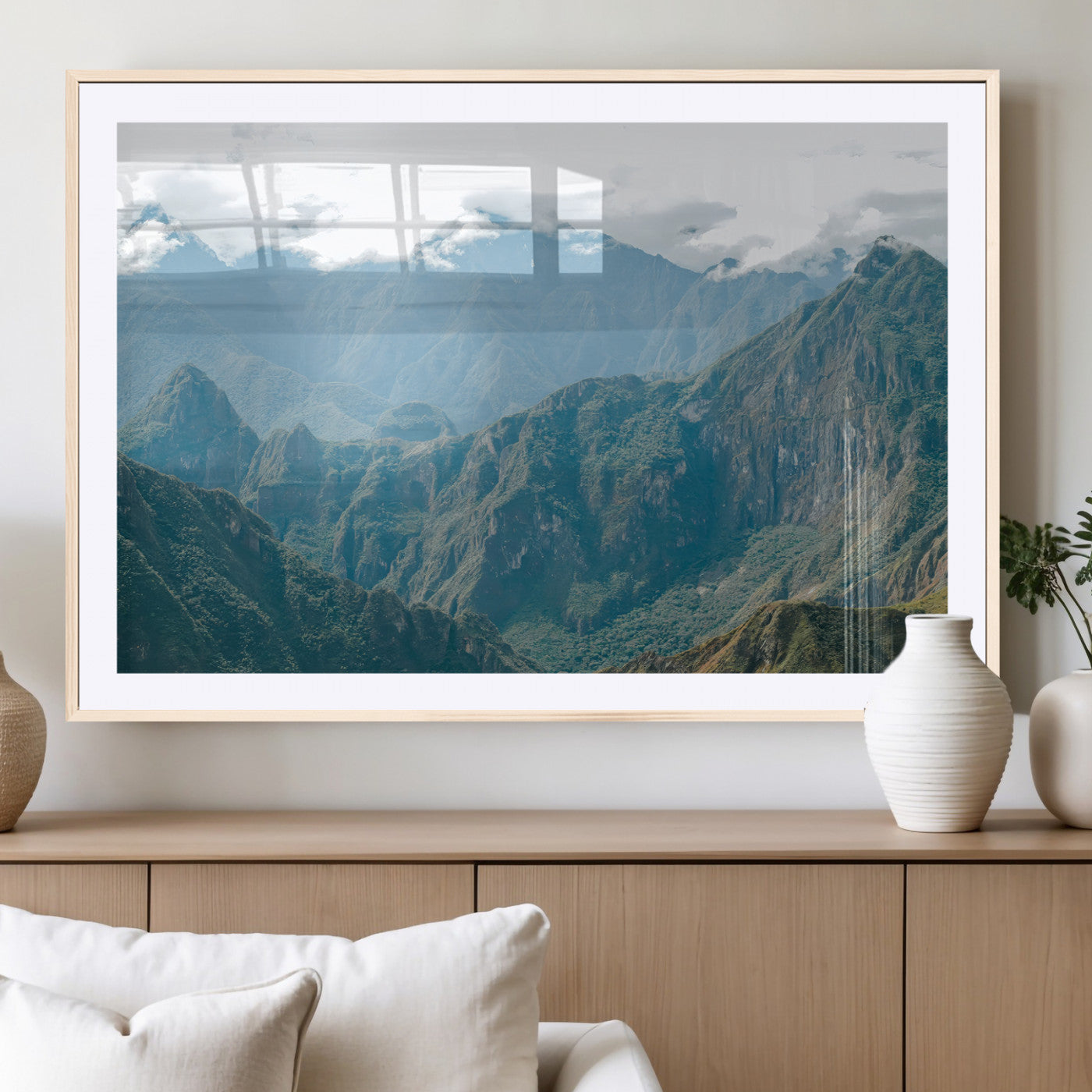 A misty mountain landscape with cloud-covered Andean peaks and lush green valleys, creating a dramatic and serene view, perfect for rustic or nature-inspired home decor.