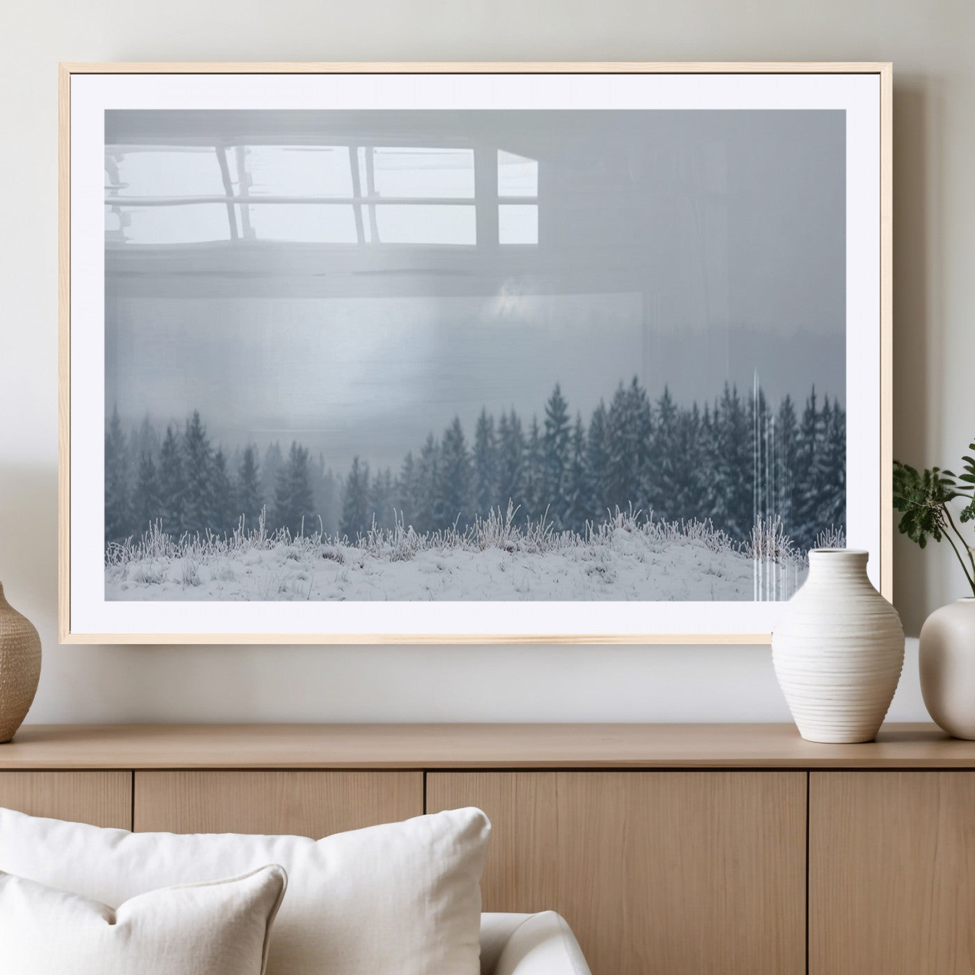 Snow-covered forest under misty sky, soft light breaking through clouds, ideal for minimalist or Nordic-inspired home decor.