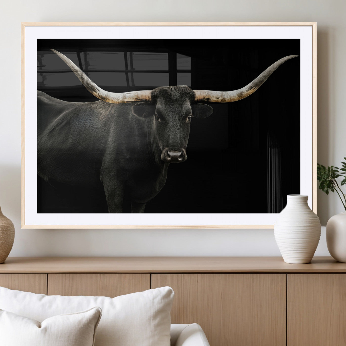 Close-up of a black Texas longhorn with large curved horns on black background, ideal for rustic farmhouse or modern western interiors.