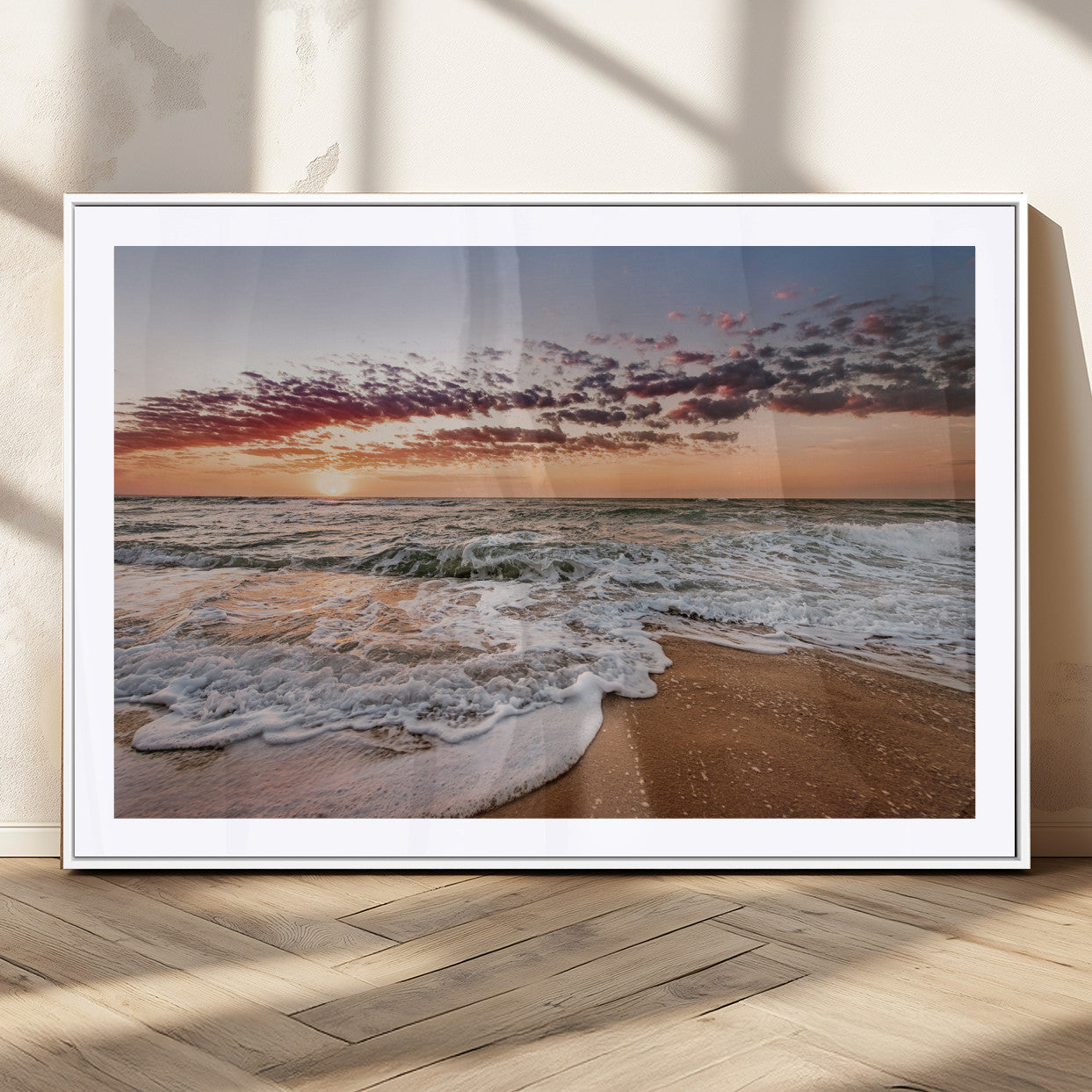 Canvas of a sunset over a foamy ocean shore with warm light and gentle waves, ideal for coastal or beach-themed home decor.