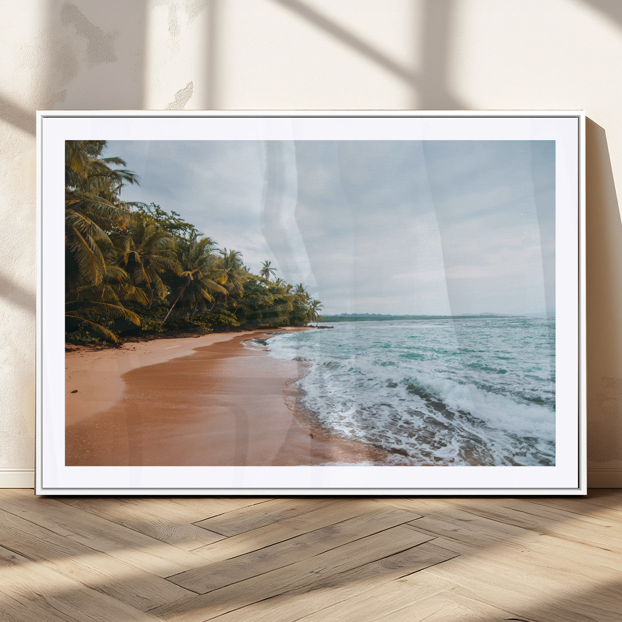 Framed canvas of a tropical beach with palm trees and soft waves, ideal for coastal escape or serene nature-inspired home decor.