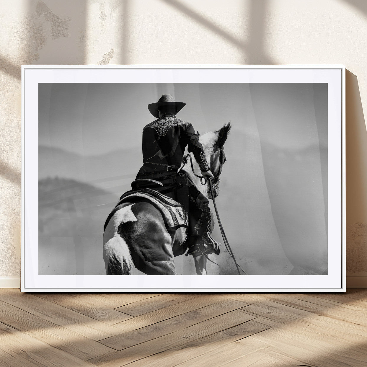 Black and white canvas of a cowboy on horseback with moody tones, perfect for rustic western or country-inspired home decor.