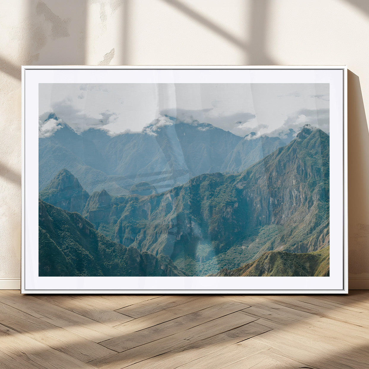A misty mountain landscape with cloud-covered Andean peaks and lush green valleys, creating a dramatic and serene view, perfect for rustic or nature-inspired home decor.