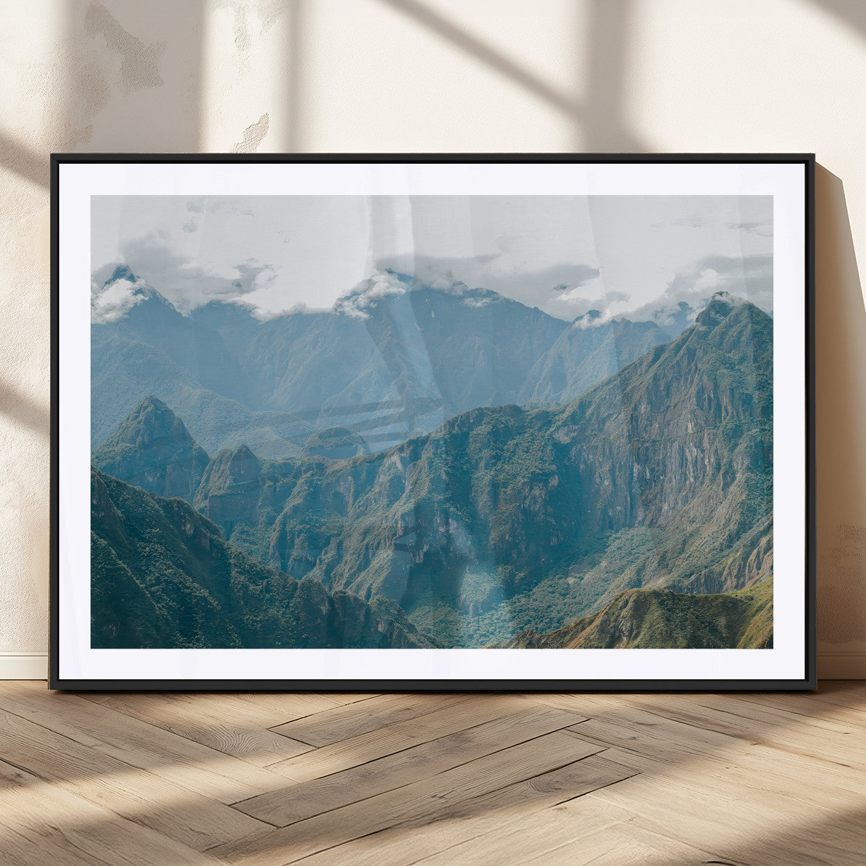 A misty mountain landscape with cloud-covered Andean peaks and lush green valleys, creating a dramatic and serene view, perfect for rustic or nature-inspired home decor.