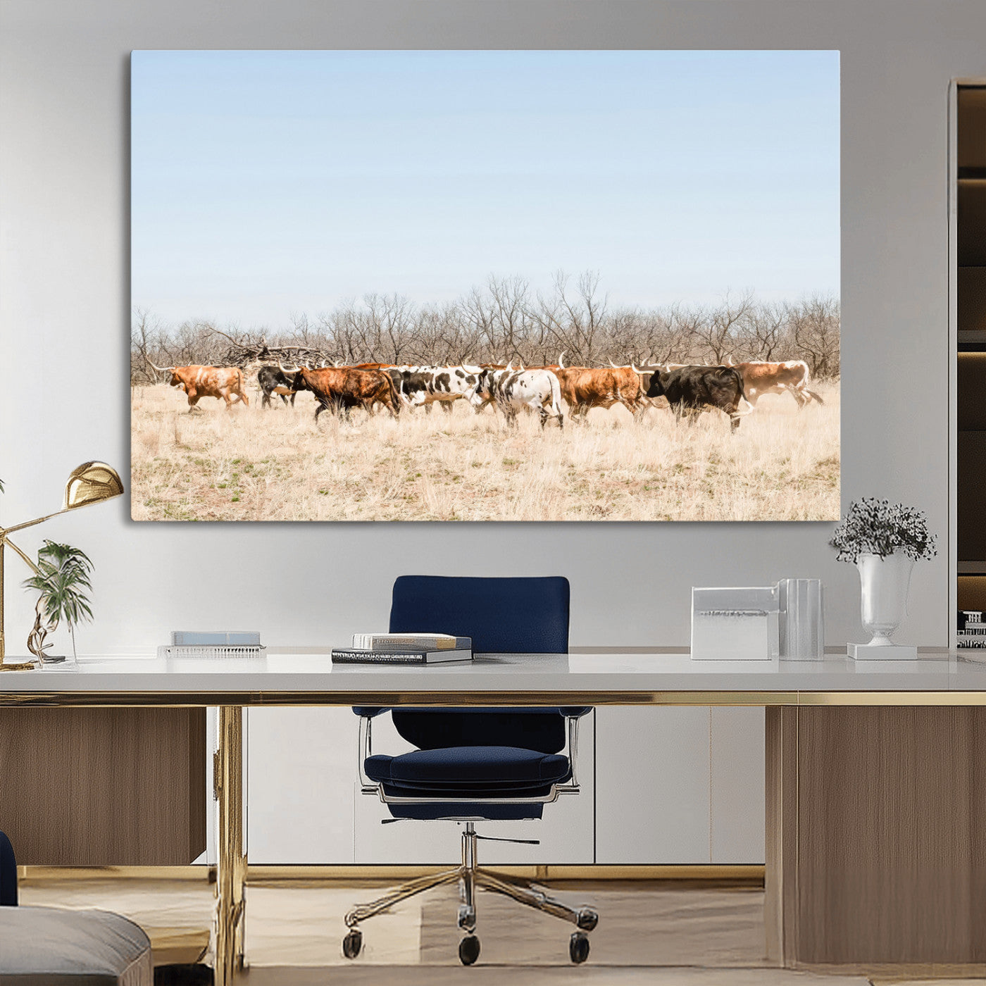 Framed wall art of Texas longhorn cattle walking through a dry, neutral-toned prairie, perfect for rustic farmhouse or western-themed home decor.