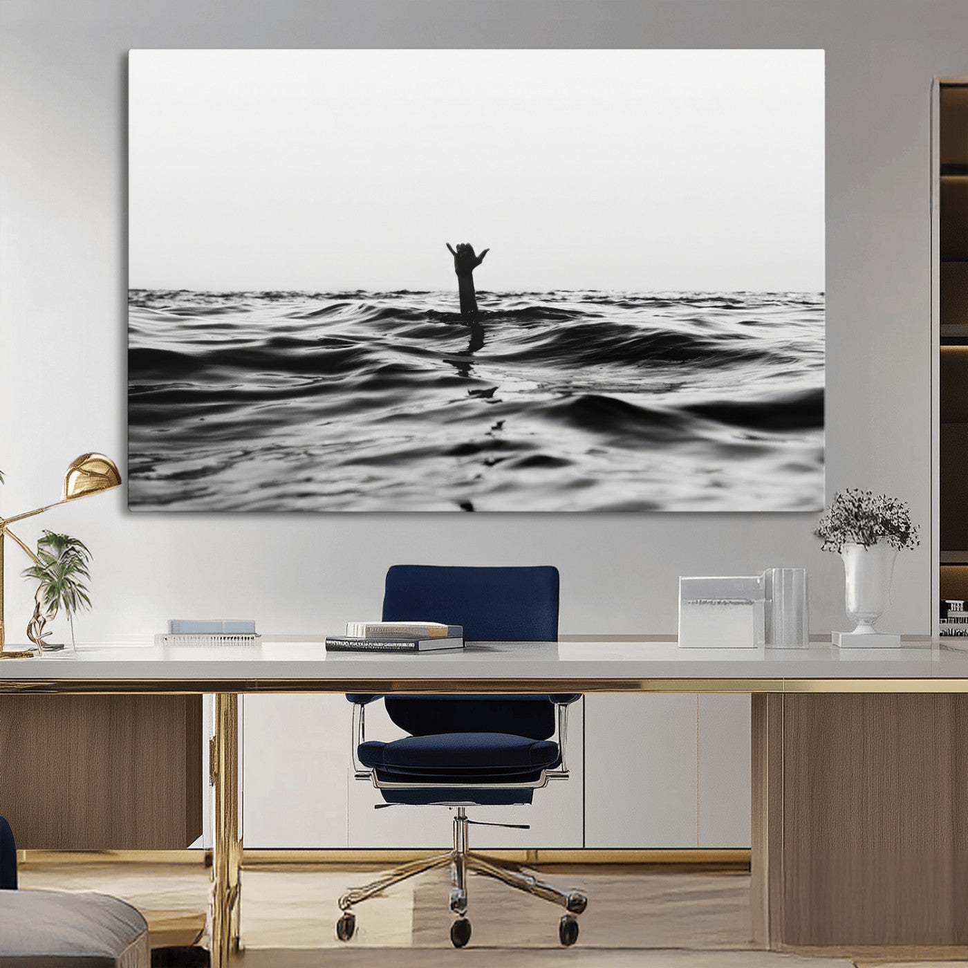 Black and white ocean with a hand making a surfer sign among dark waves, creating a dramatic and minimalist seascape with bold contrast.