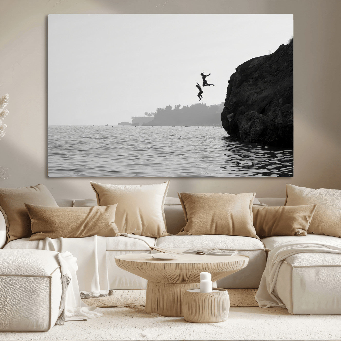 Black and white canvas of two figures cliff jumping into the sea, captured with moody tones, ideal for modern coastal or adventure-themed home decor. 2/2
