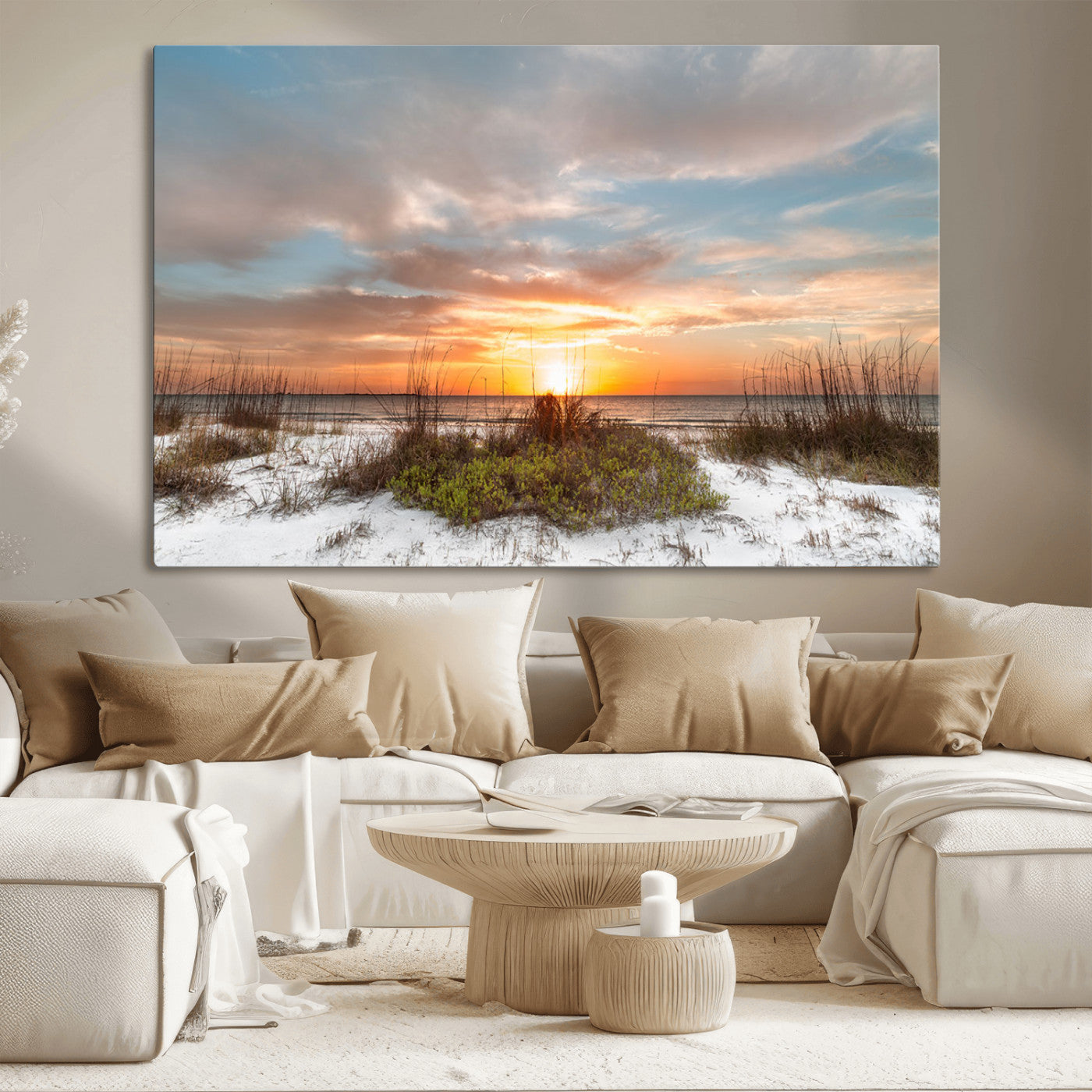 A tranquil beach scene featuring golden sunset hues over the water, with grasses in the foreground and a peaceful, serene atmosphere.