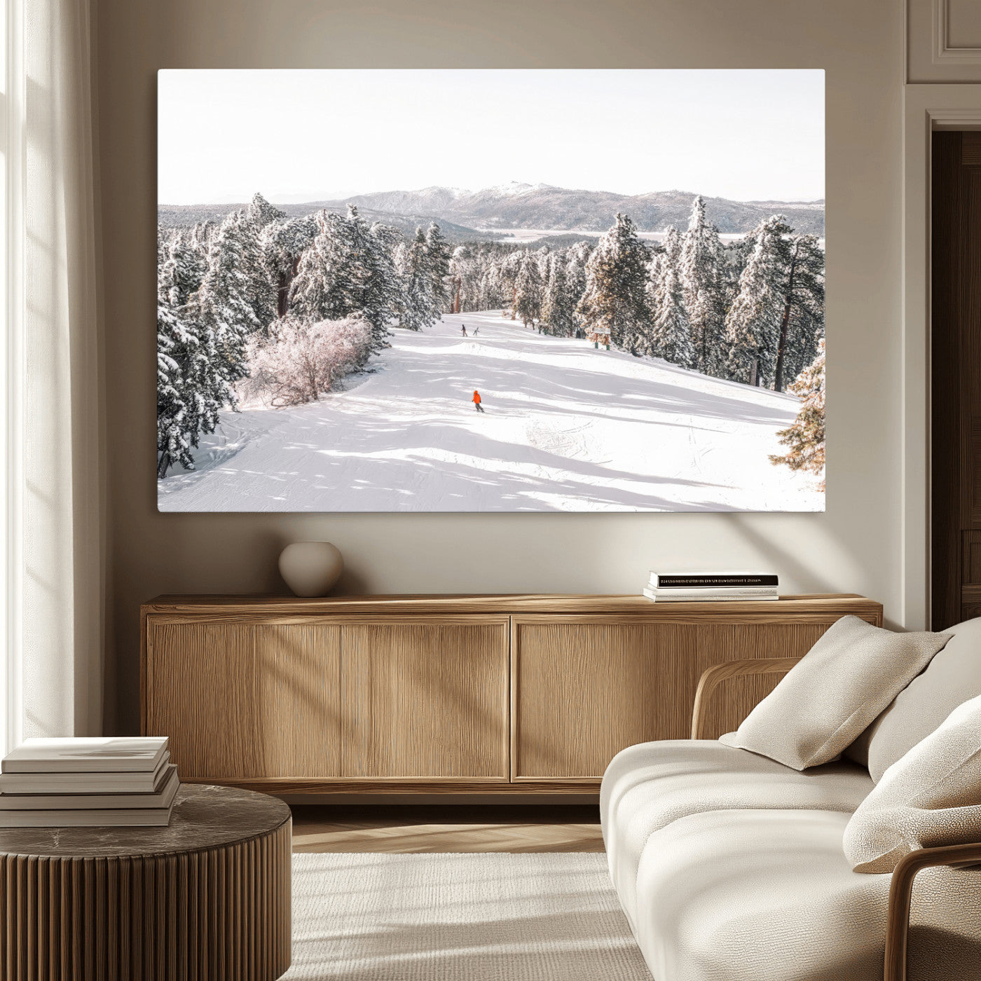 Bright ski trail lined with snow-covered pines and a skier in orange, perfect for alpine adventure or winter sports-inspired decor.
