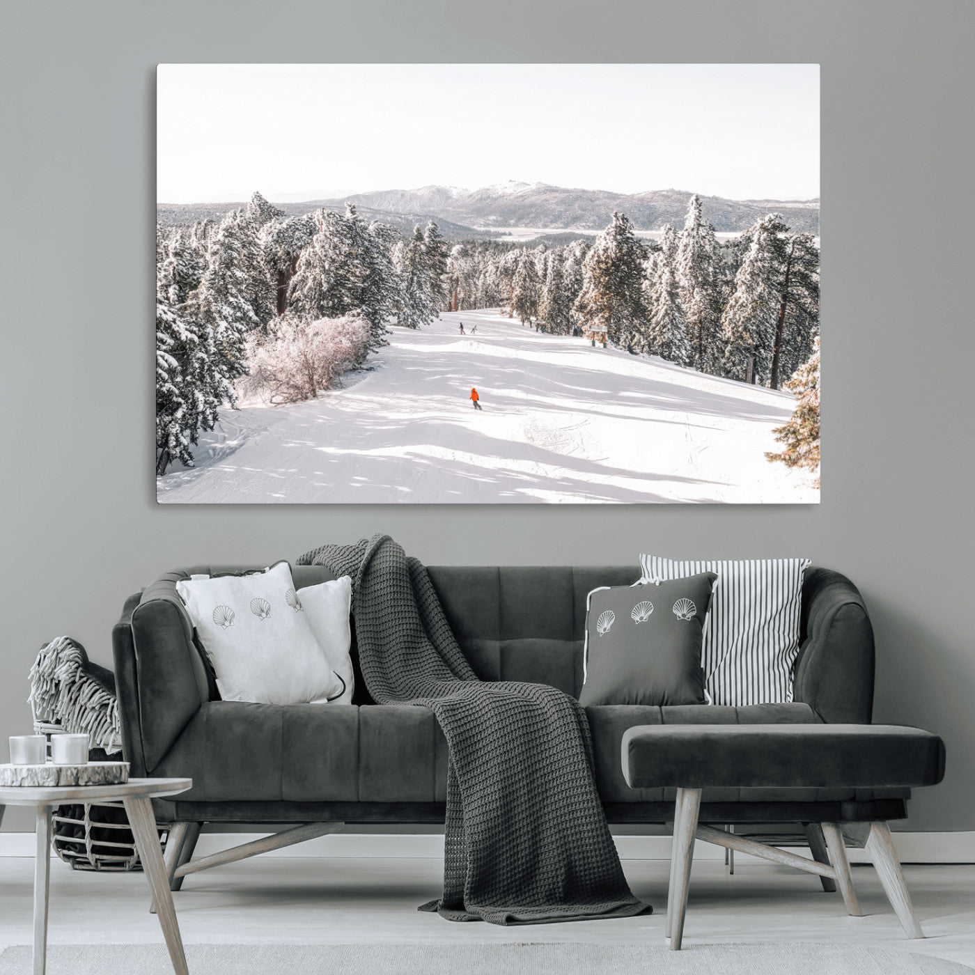 Bright ski trail lined with snow-covered pines and a skier in orange, perfect for alpine adventure or winter sports-inspired decor.