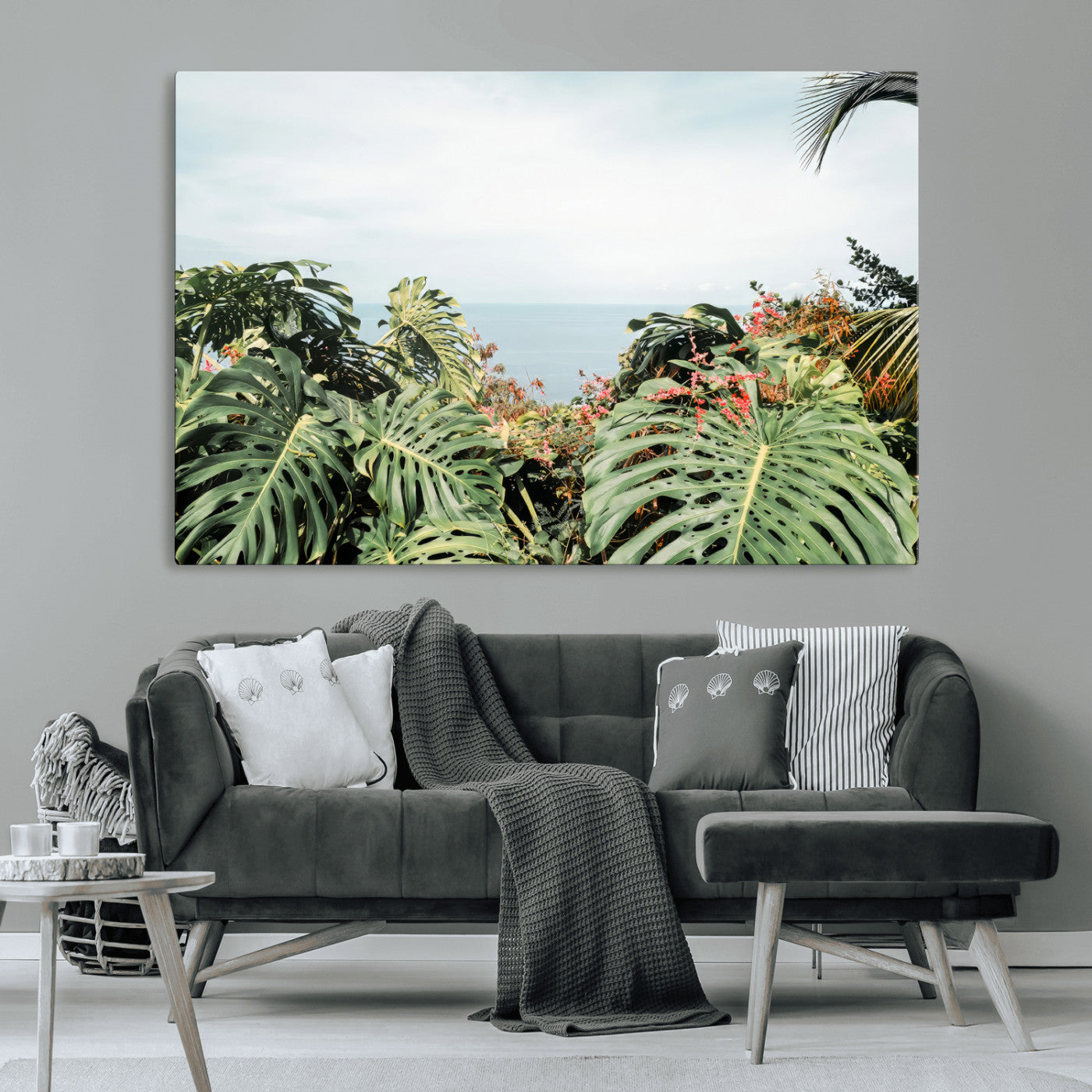 Monstera leaves and tropical flowers framing a calm ocean view, ideal for tropical coastal or exotic jungle-style interior wall decor.