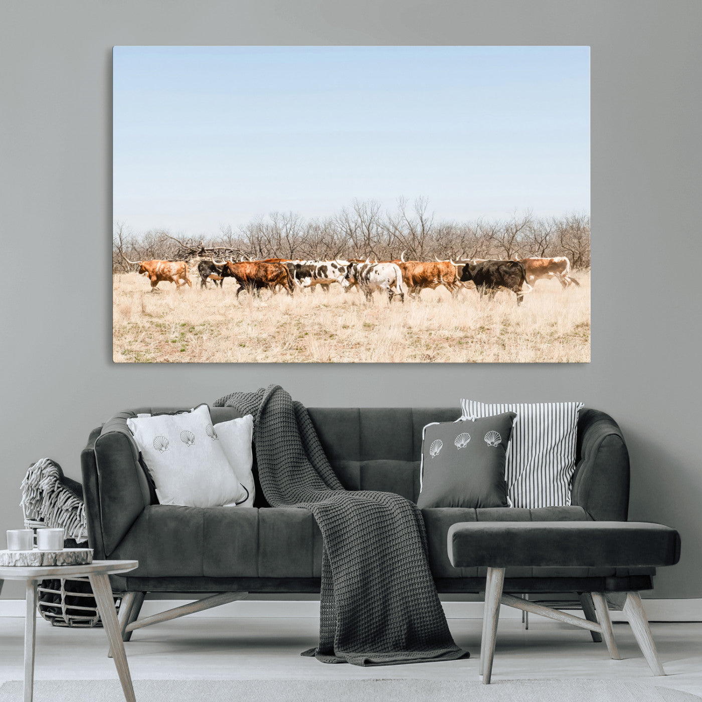 Framed wall art of Texas longhorn cattle walking through a dry, neutral-toned prairie, perfect for rustic farmhouse or western-themed home decor.