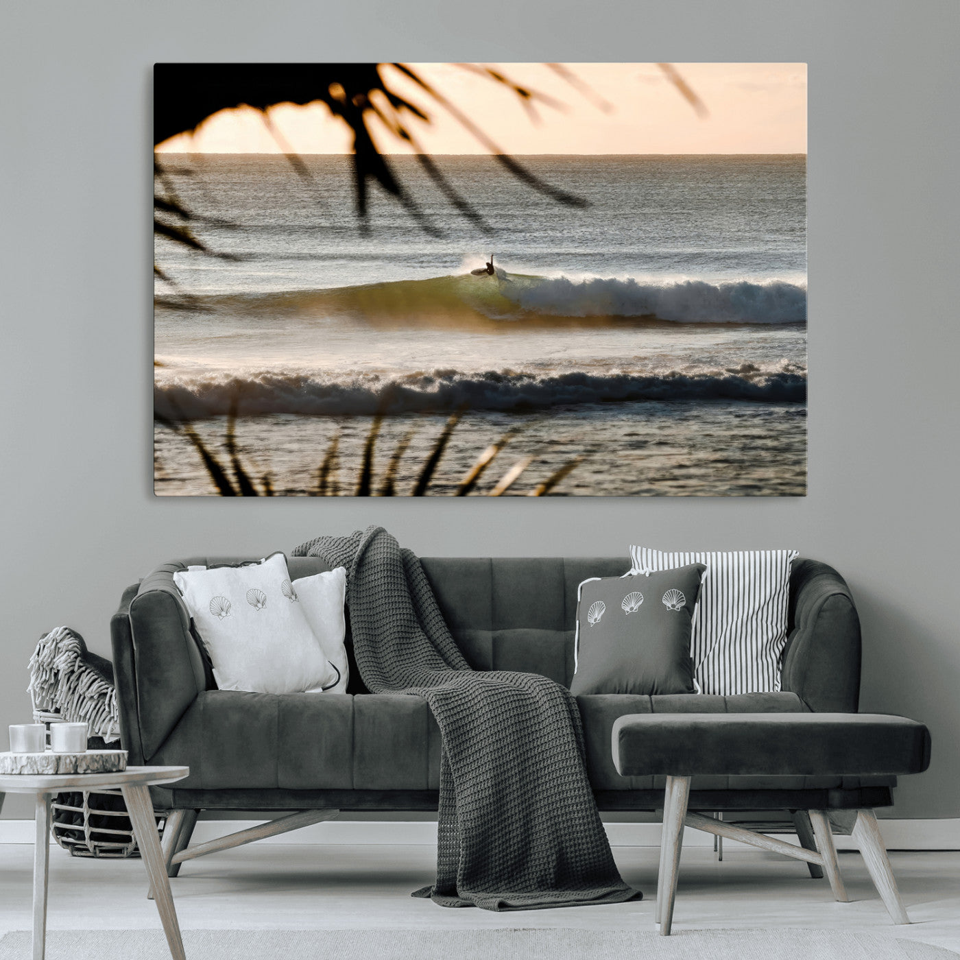 Photo of a surfer riding a golden hour wave at sunset, with tropical tones and dreamy light, perfect for tropical boho or coastal home decor.
