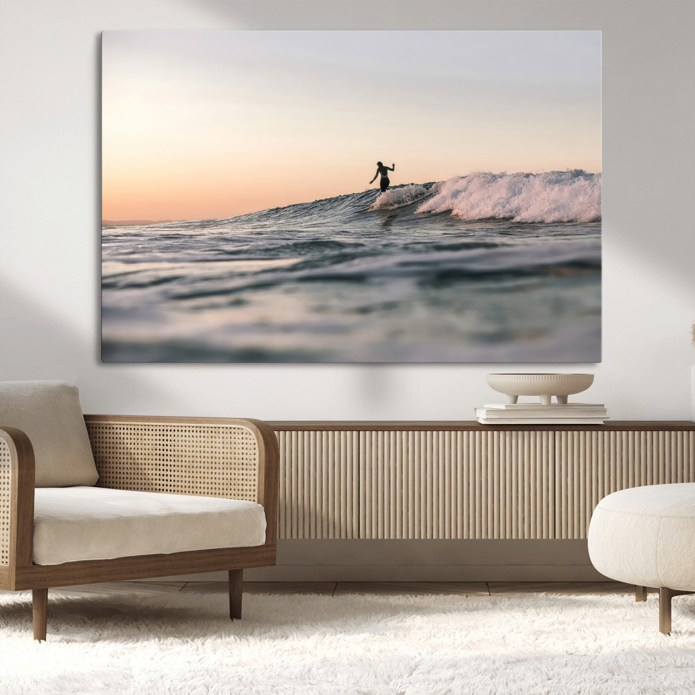 Framed canvas of a female surfer balancing on a wave at sunset, perfect for serene surf or ocean-inspired coastal decor.