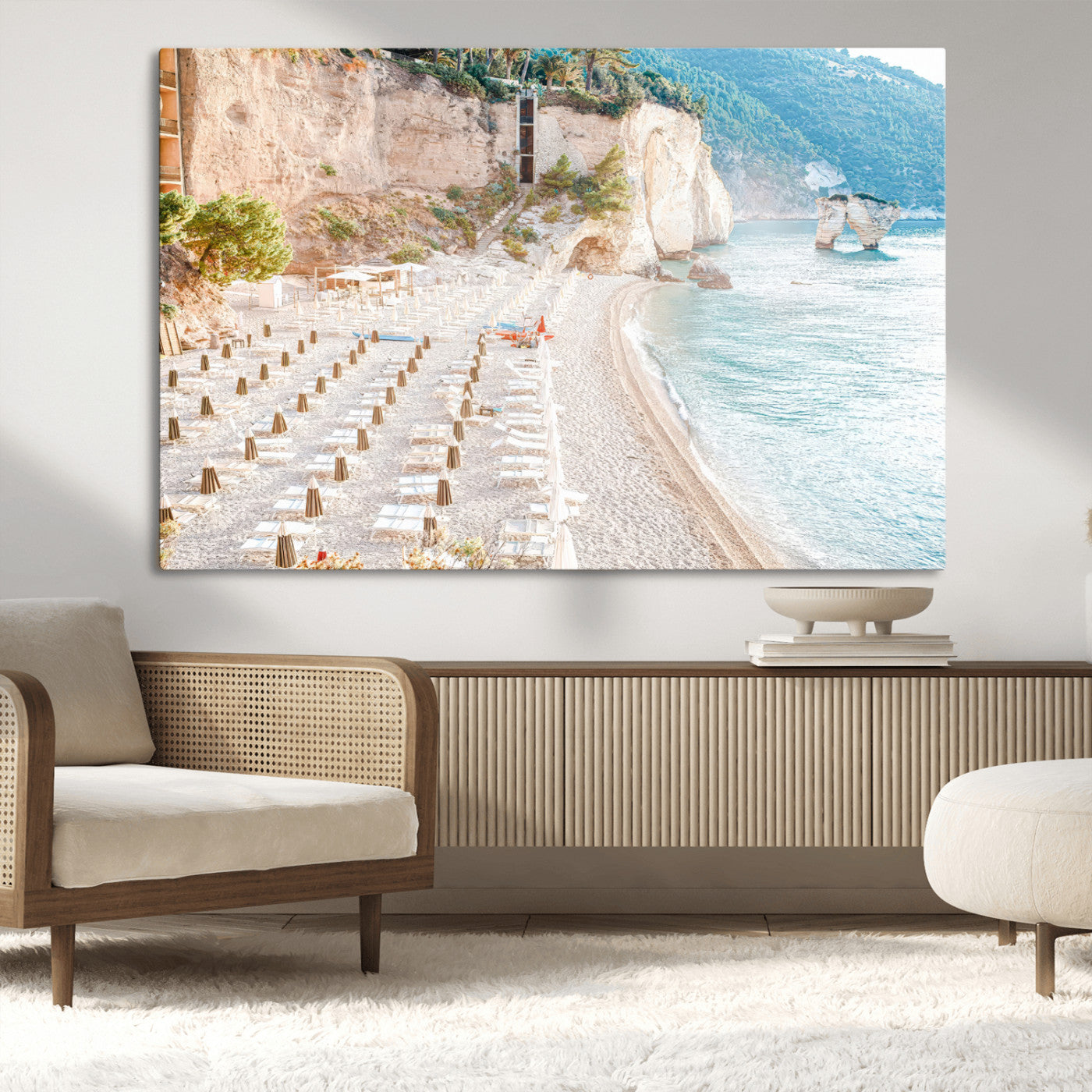 Wall art of a calm Mediterranean beach with rows of sun loungers and umbrellas in soft pastel tones, perfect for light coastal or vacation-themed decor.