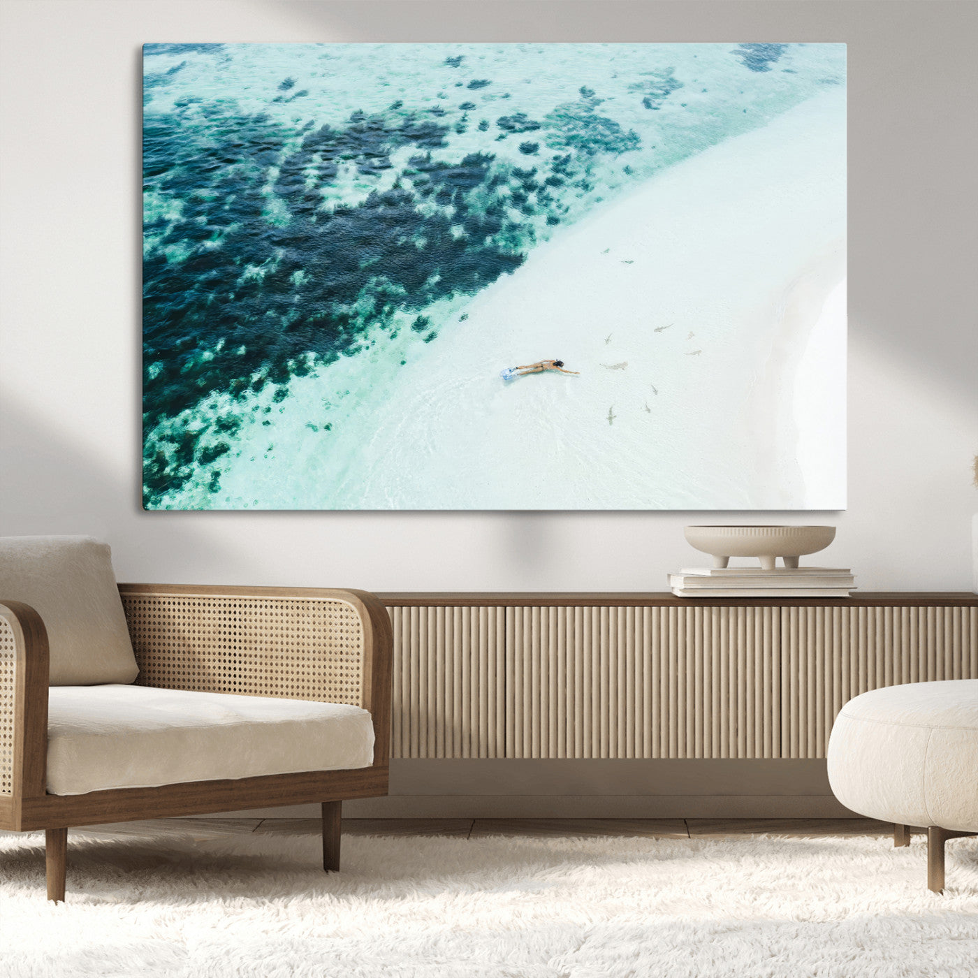 Canvas featuring an aerial view of a swimmer in shallow turquoise waters with coral patterns, ideal for tropical coastal home decor.