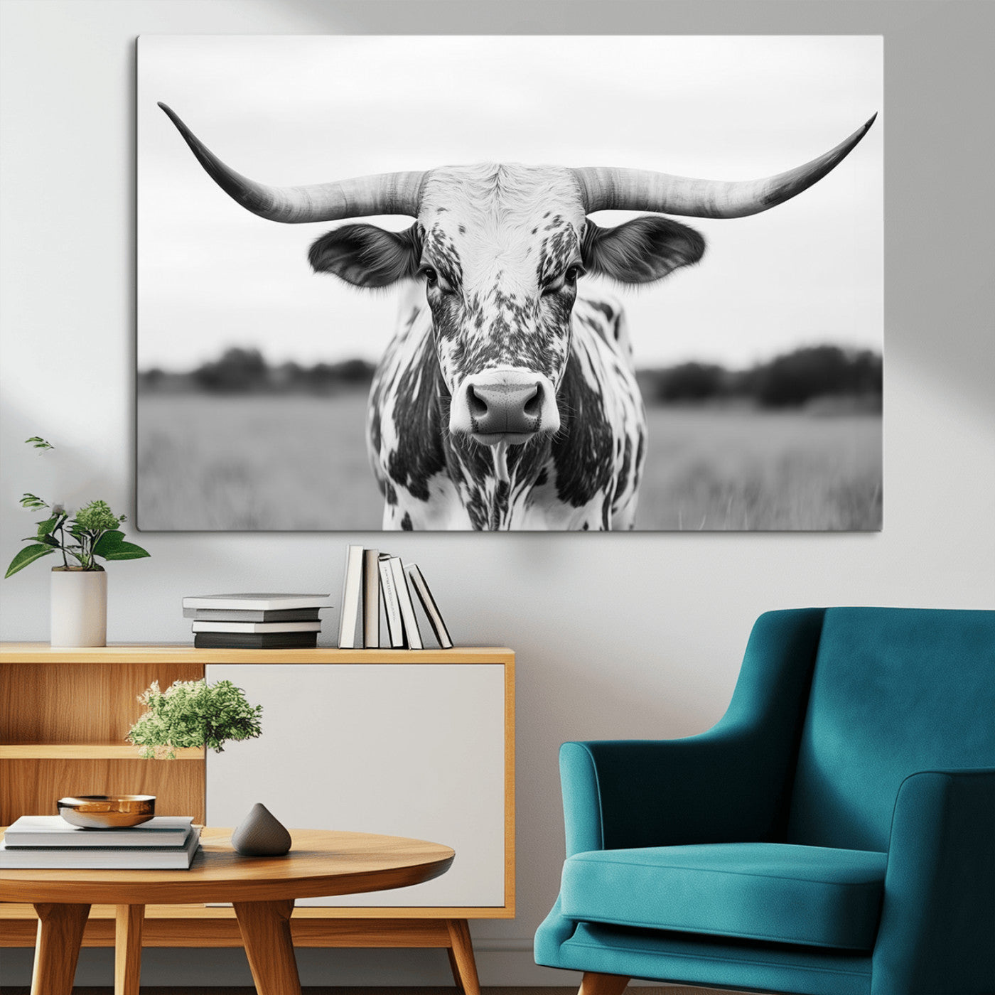 Capture the strength and elegance of nature with this striking black and white portrait of a longhorn cow. Its powerful presence makes a bold statement in any room.