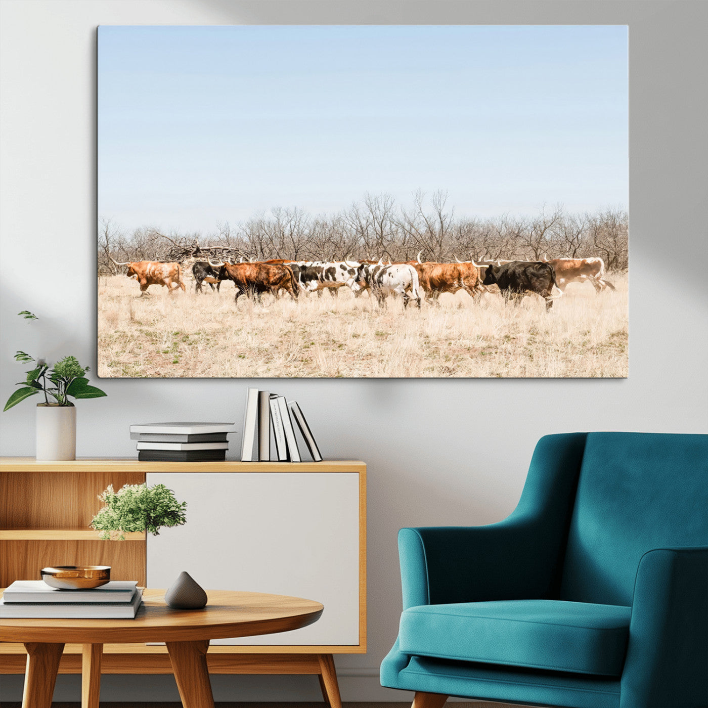 Framed wall art of Texas longhorn cattle walking through a dry, neutral-toned prairie, perfect for rustic farmhouse or western-themed home decor.