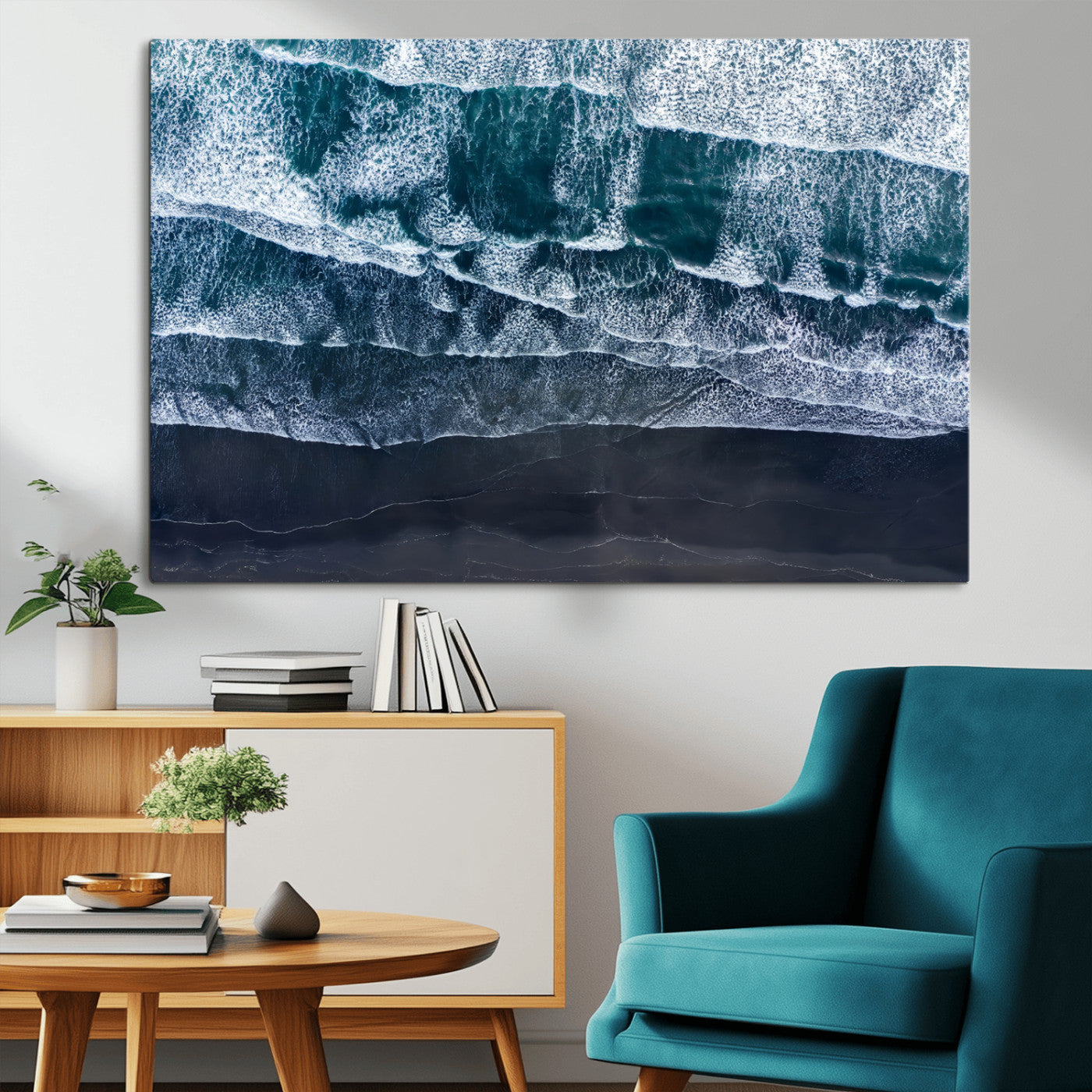 Canvas of aerial ocean waves crashing onto a black sand beach in moody tones, ideal for modern coastal or minimalist home decor.