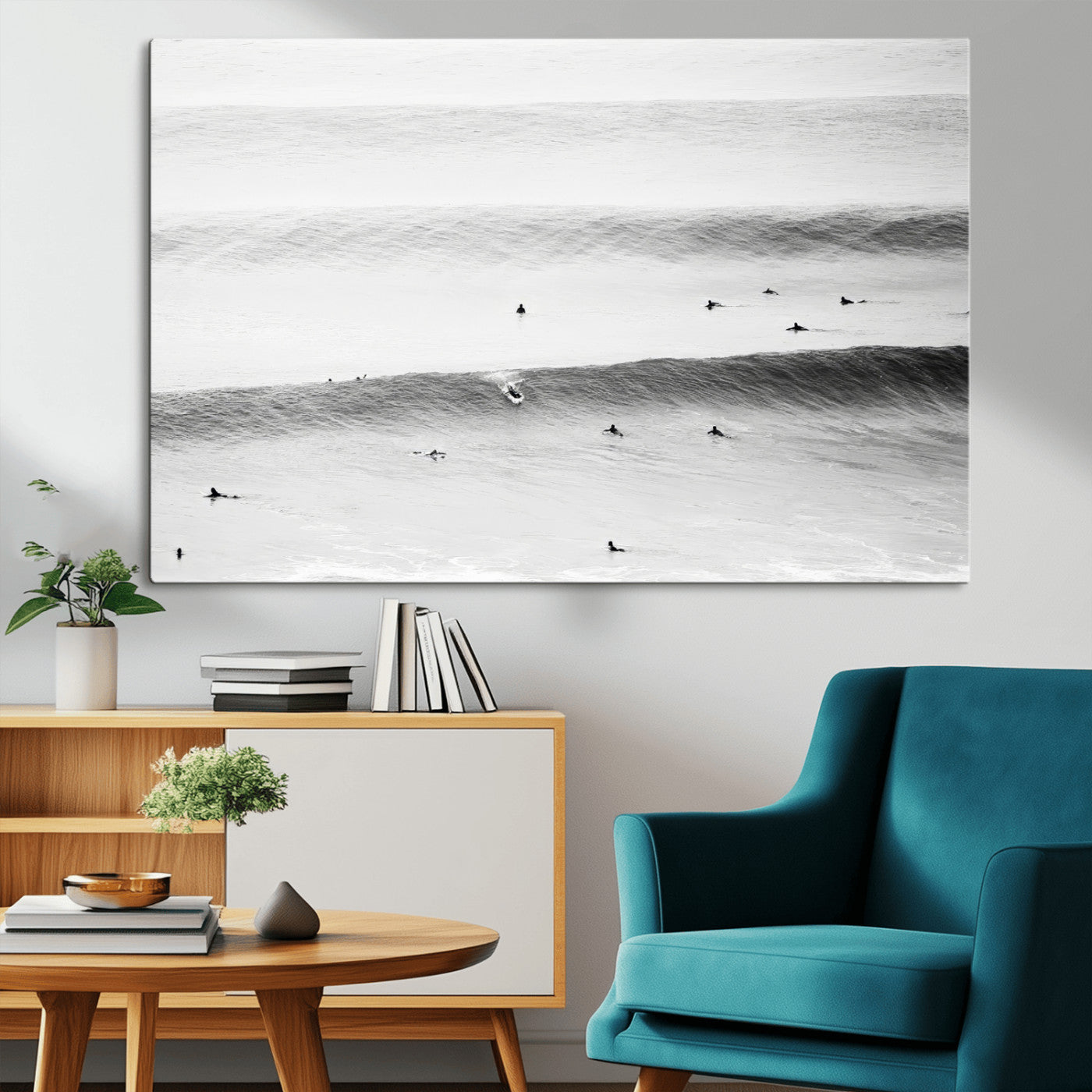 A monochrome photograph of swimmers gliding through gentle ocean waves, evoking a sense of calm and movement.