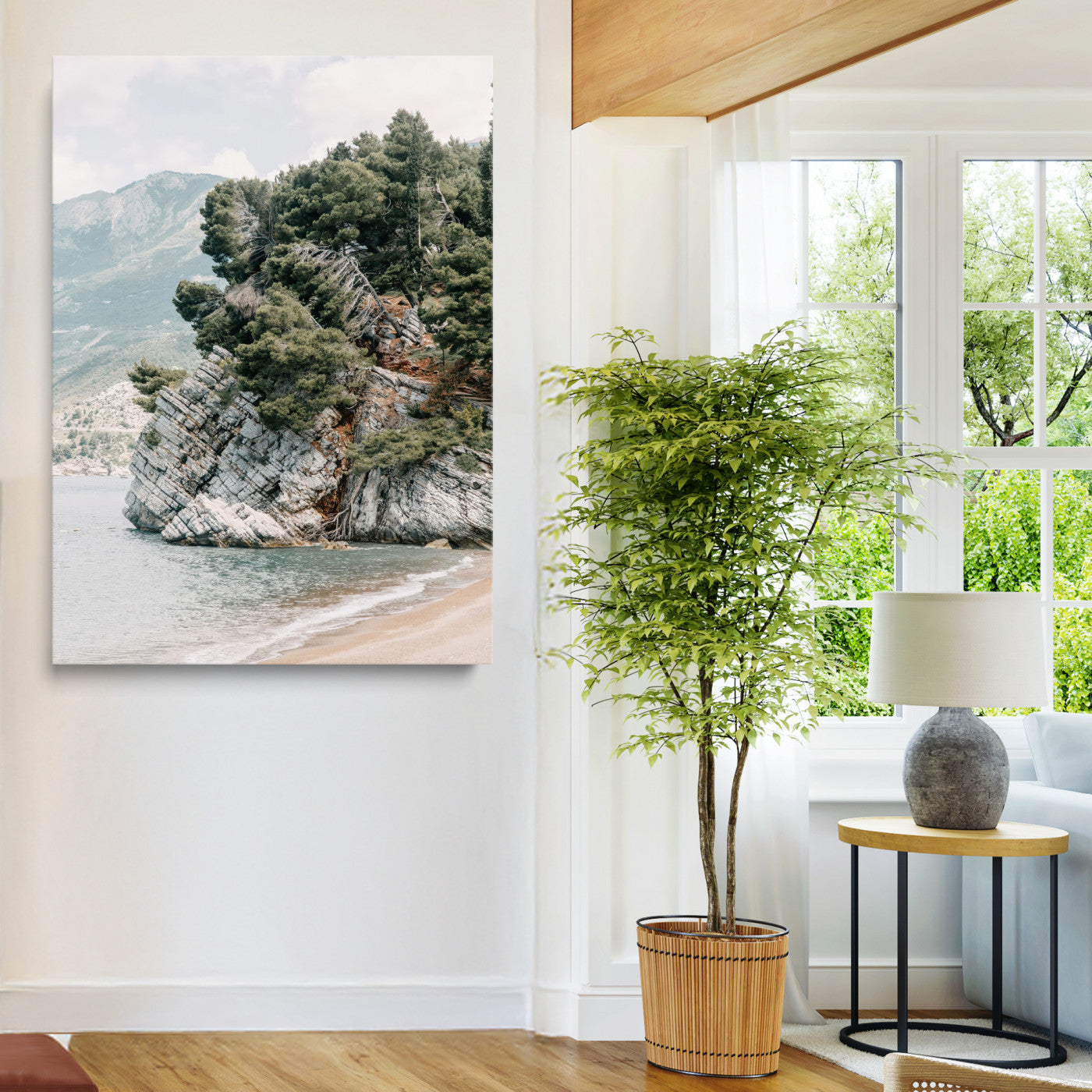 Framed photo of a rocky coastal cliff with dense greenery and calm shoreline, ideal for rustic coastal or earthy-toned home decor.