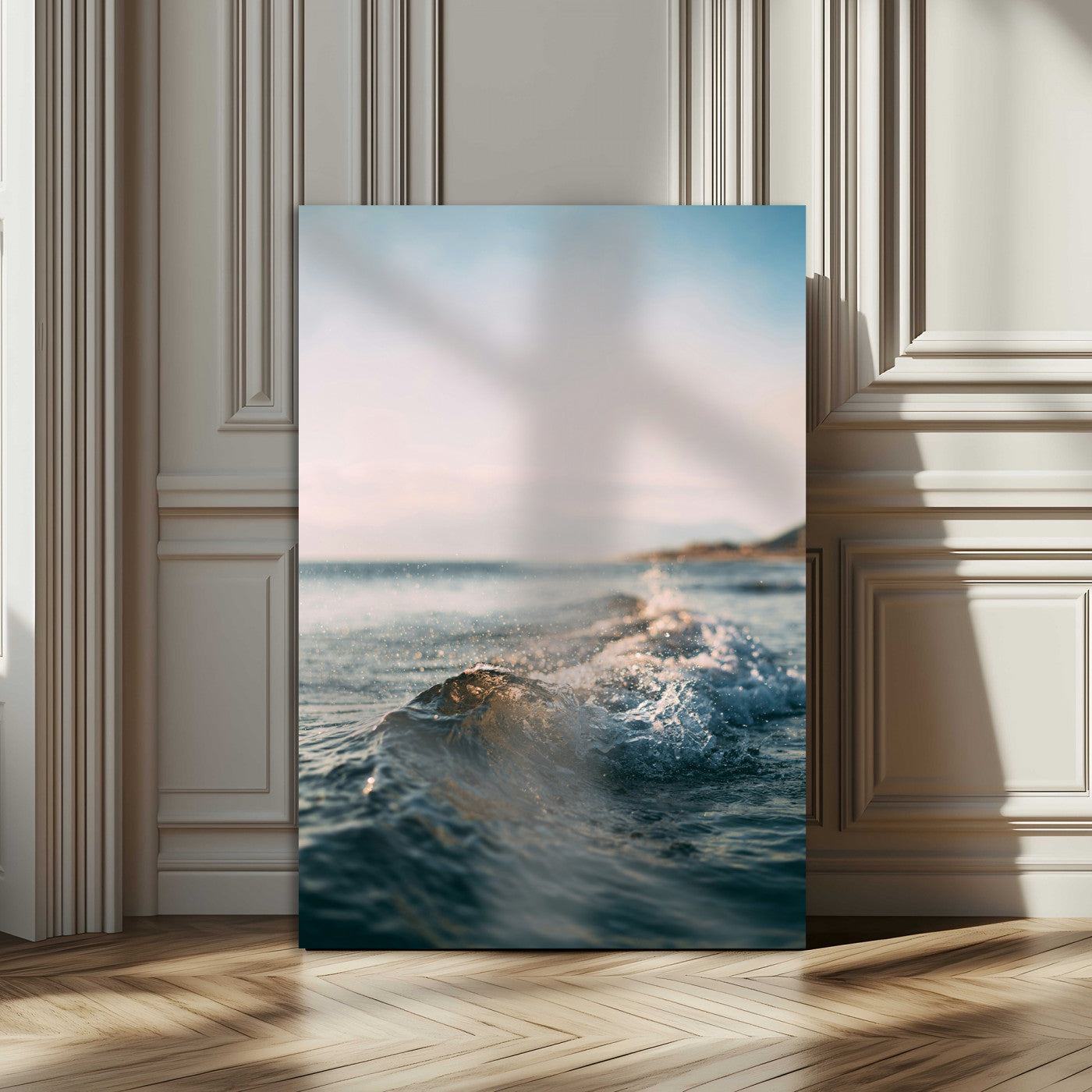 Close-up of ocean waves rolling gently toward the shore at sunset, creating a peaceful and minimalist coastal scene.