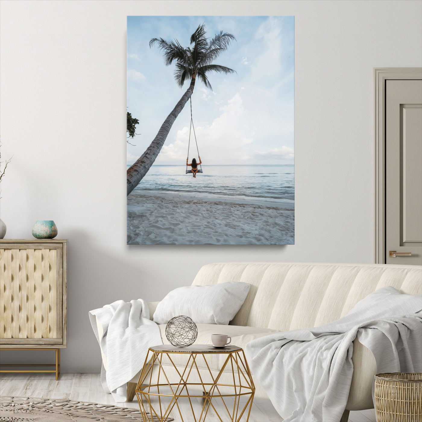 Wall art of a girl on a swing hanging from a palm tree over calm ocean waters, perfect for tropical or minimalist coastal decor.