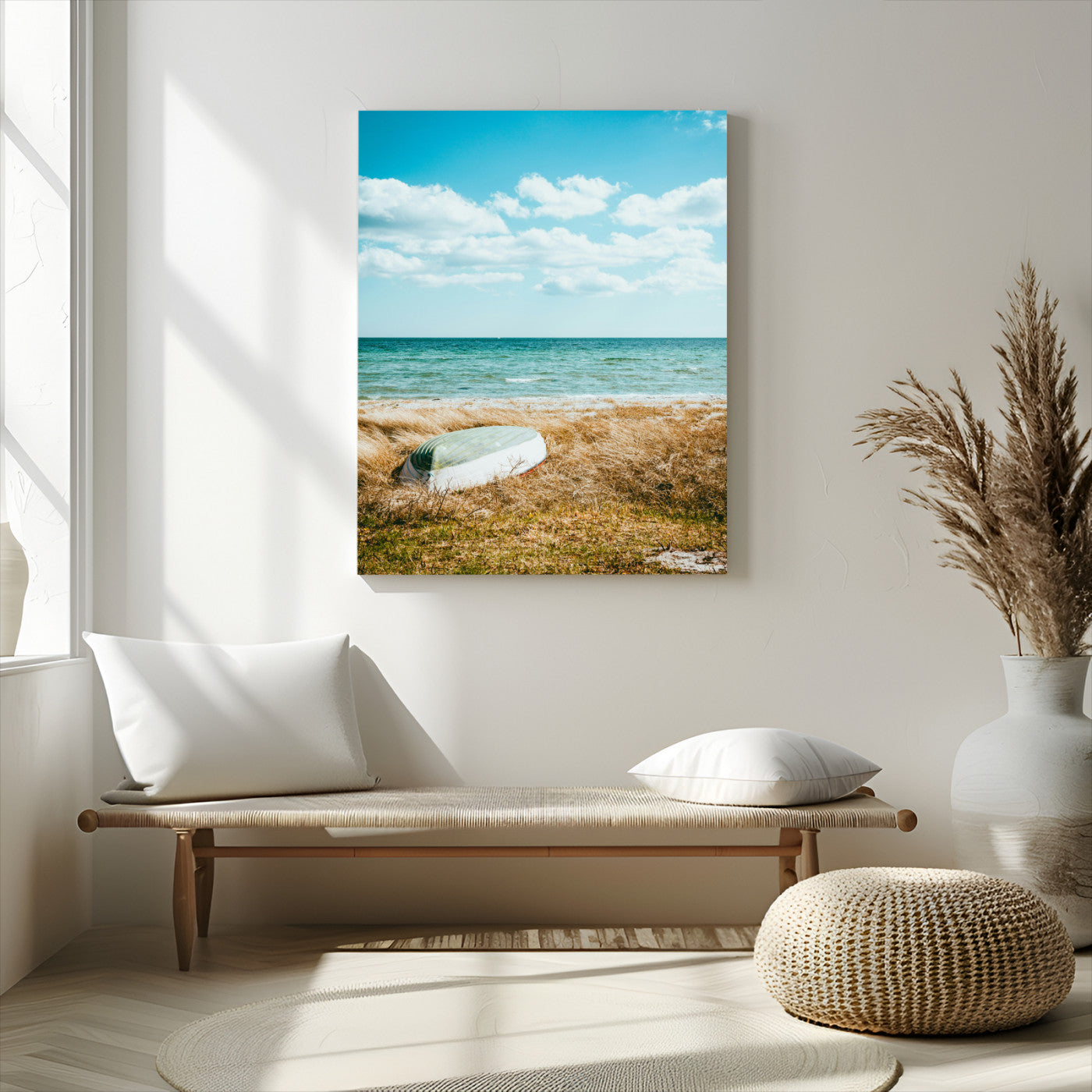 A small boat resting on a grassy shore with ocean waves and a bright blue sky, creating a peaceful coastal atmosphere.