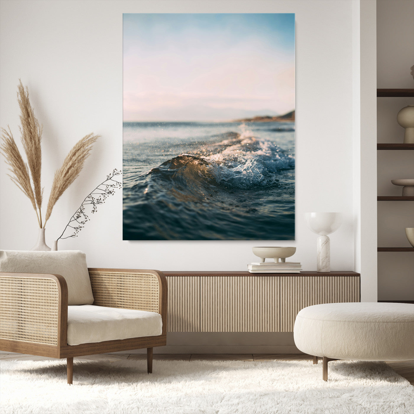 Close-up of ocean waves rolling gently toward the shore at sunset, creating a peaceful and minimalist coastal scene.