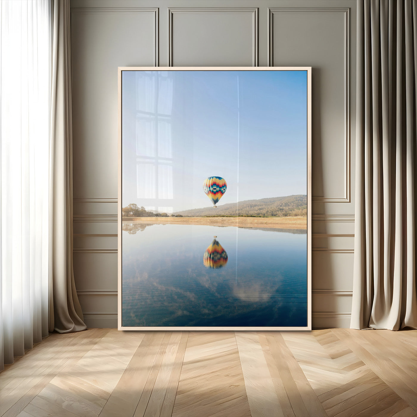 Canvas of a hot air balloon floating above a calm lake with soft reflections and vibrant sky, ideal for modern minimalist or adventure-themed home decor.