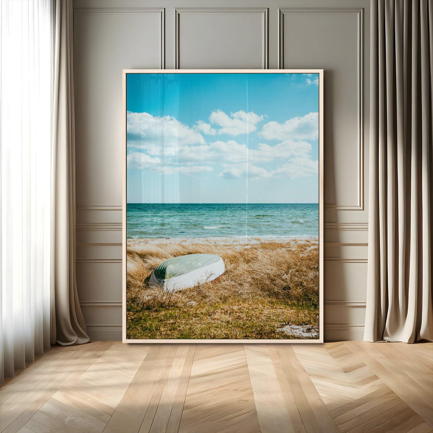 A small boat resting on a grassy shore with ocean waves and a bright blue sky, creating a peaceful coastal atmosphere.