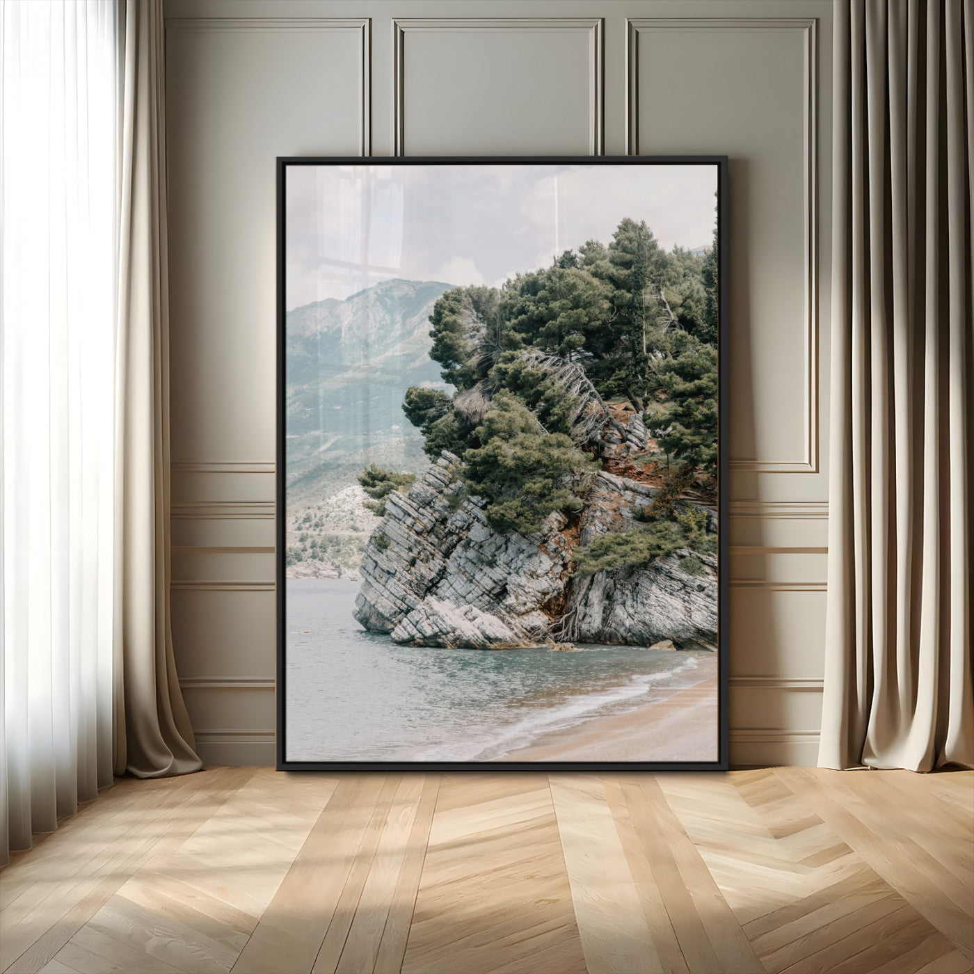 Framed photo of a rocky coastal cliff with dense greenery and calm shoreline, ideal for rustic coastal or earthy-toned home decor.