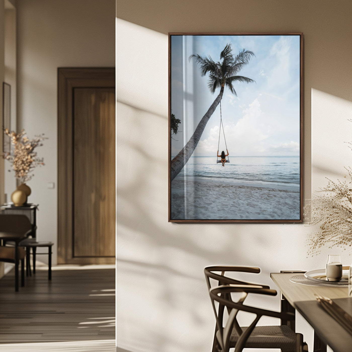 Wall art of a girl on a swing hanging from a palm tree over calm ocean waters, perfect for tropical or minimalist coastal decor.