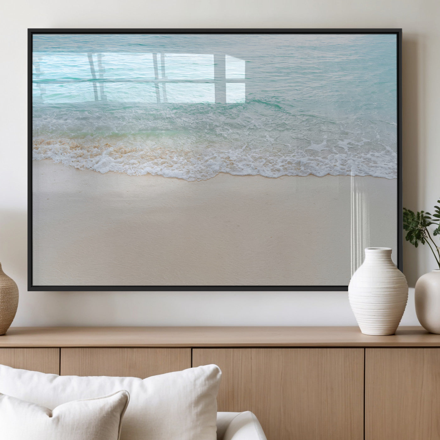Soft shoreline with gentle aqua waves on smooth sand, ideal for minimalist coastal or pastel ocean-inspired home wall decor.